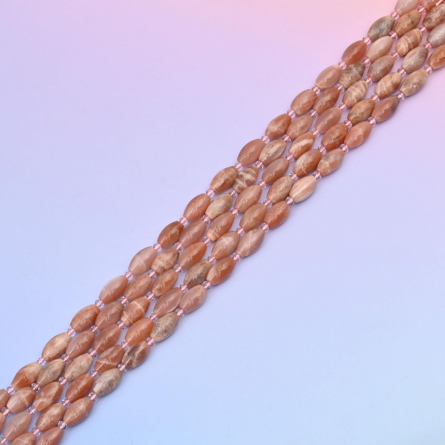 Sunstone beads in warm peach and apricot tones