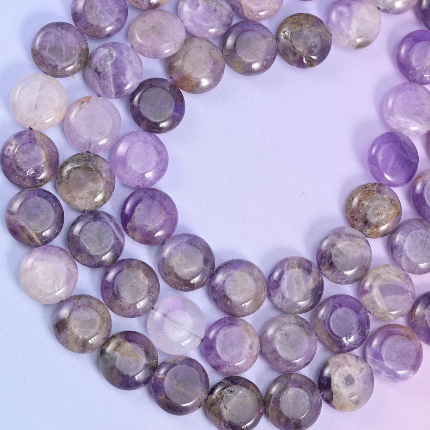 Looped Amethyst coin strand with milky white and deep purple zones