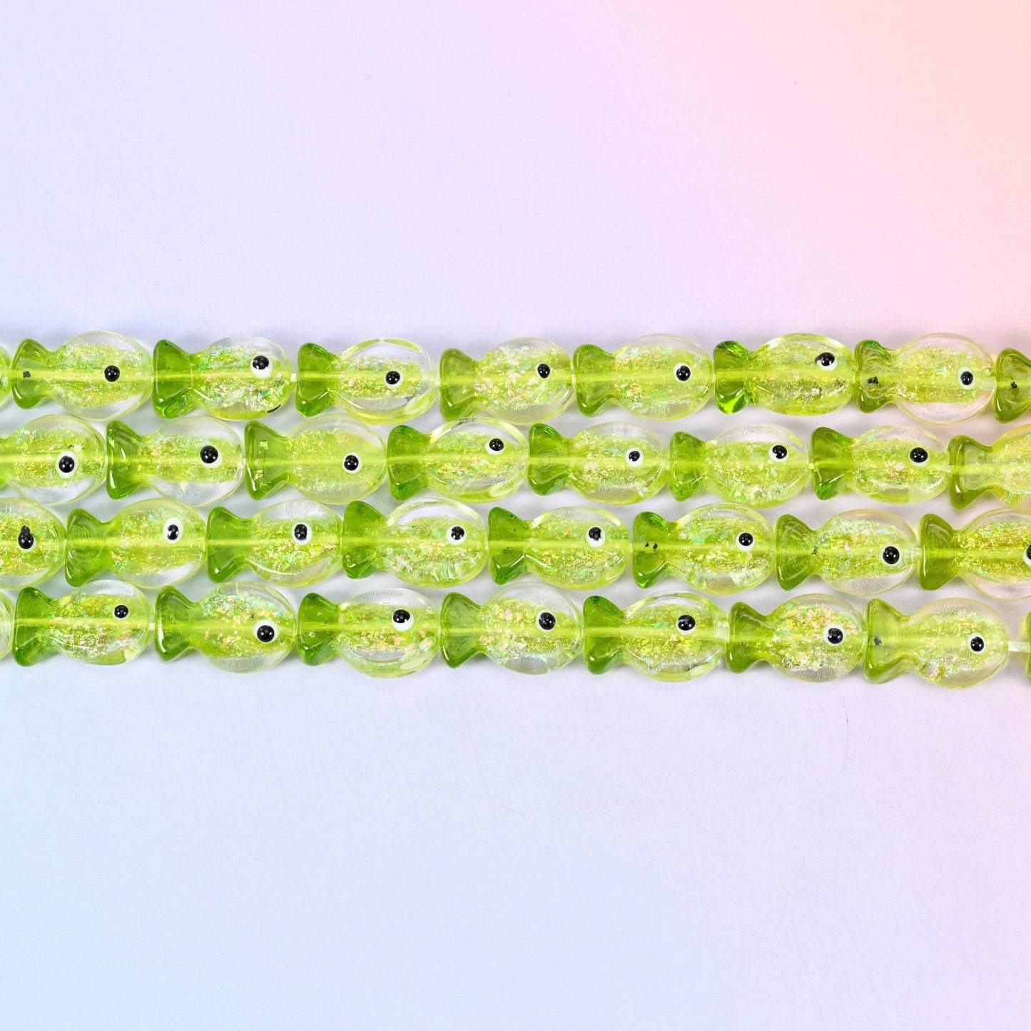 Iridescent Lime Green Fish Glass Beads in bright translucent lime with glitter