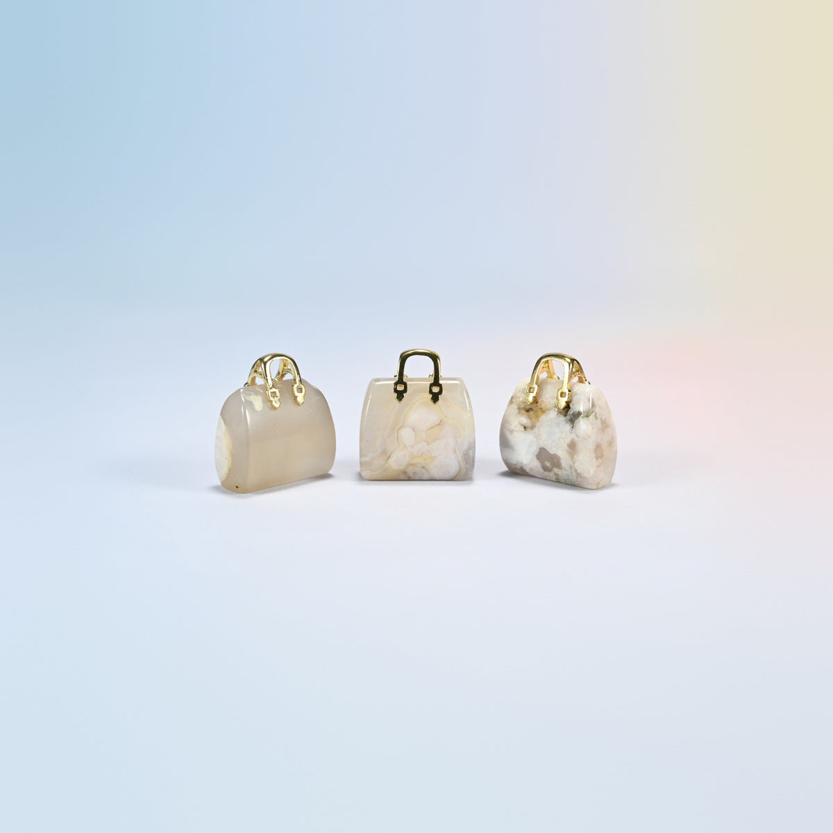 Three sakura agate purse crystal carvings, 1 inch, cream natural stone with pink flower patterns, gold-tone handle