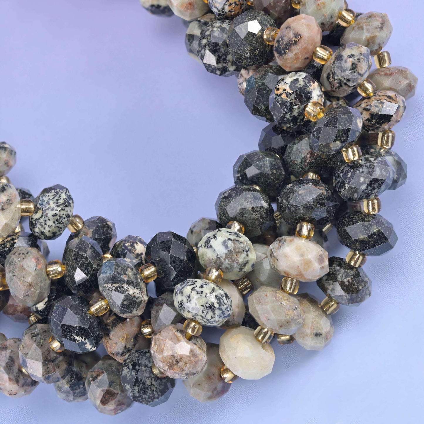 Faceted rondelle cut Old African Howlite beads