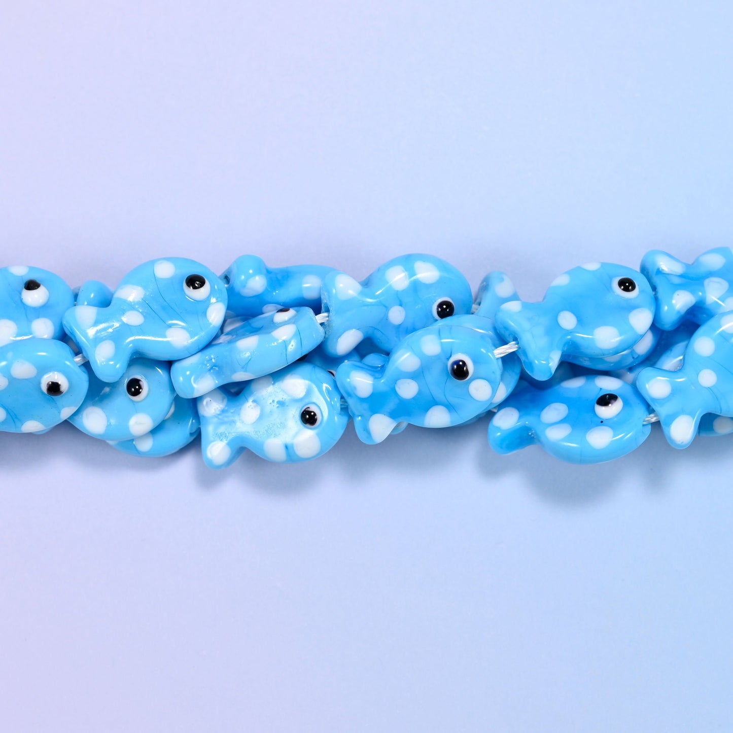Sky Blue with White Dot Fish Glass Beads, a round-bellied fish in glossy opaque sky blue with white dots