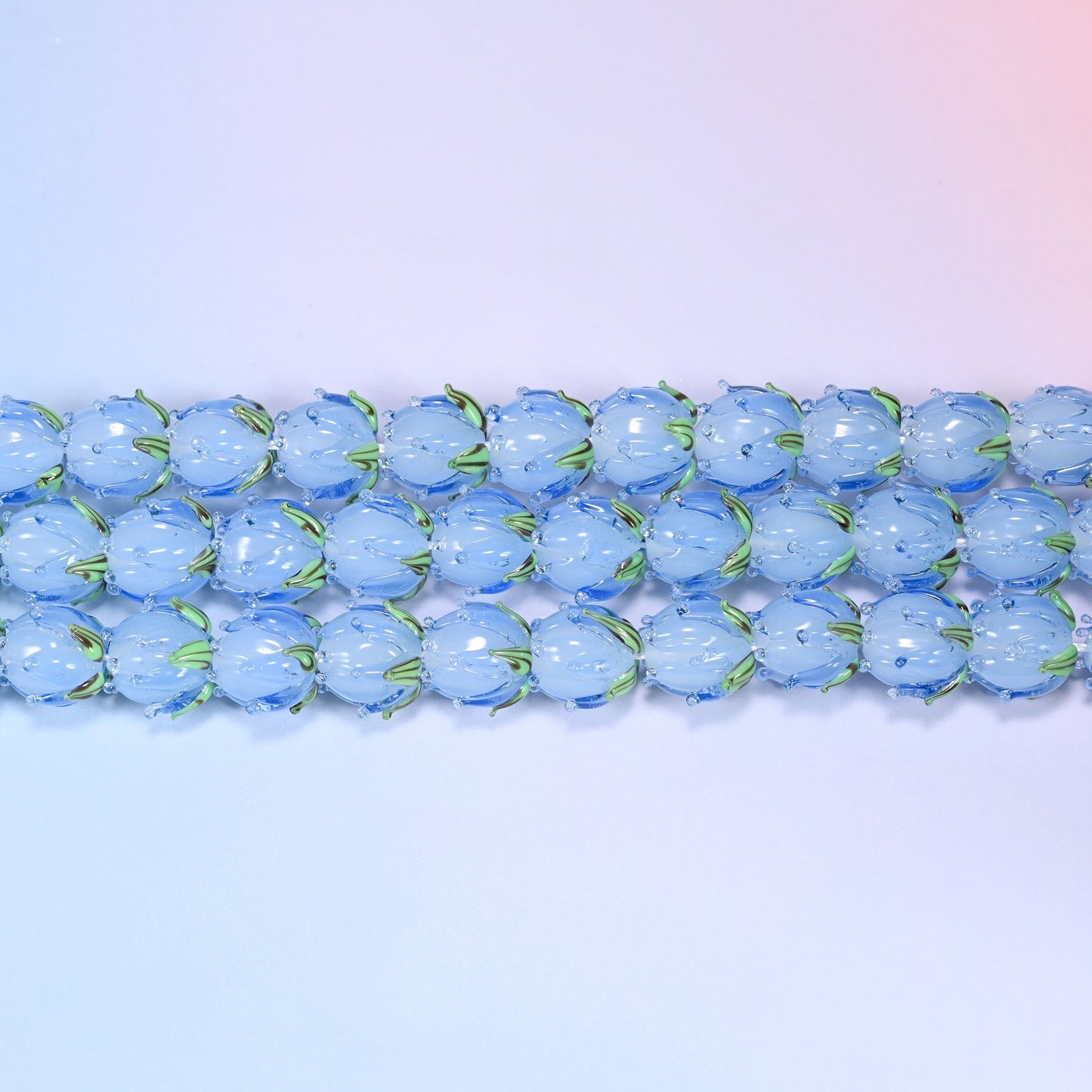 Blue Tulip Flower Bud Lampwork Glass Beads 14mm in blue with green leaf detail