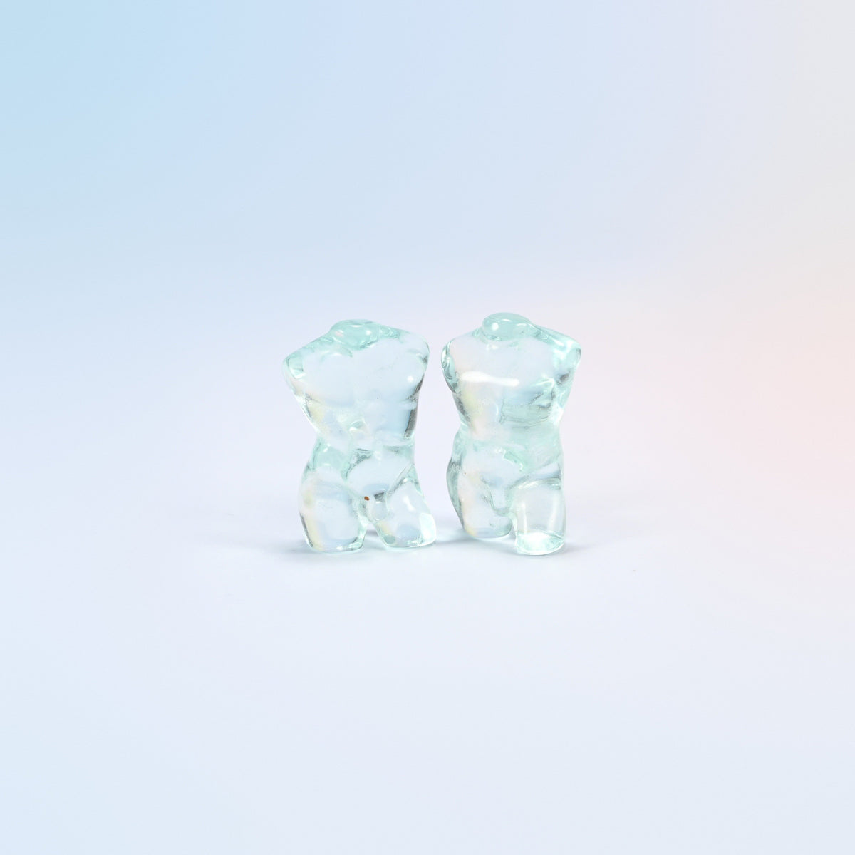 Two aqua blue glass male goddess torso carvings, 1.3 inch, man-made glass