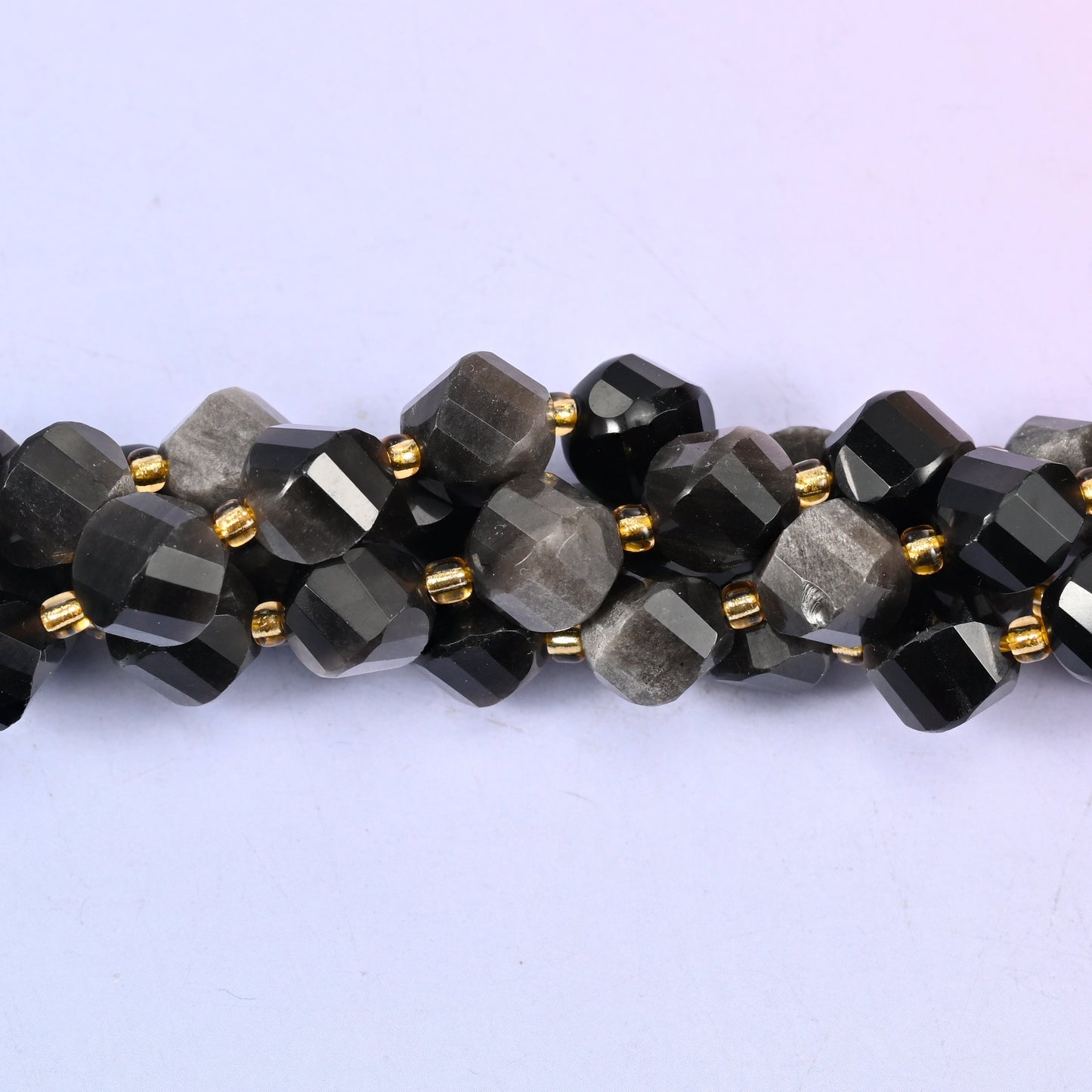 Silver Obsidian natural stone beads used as spacer or focal beads in handmade jewelry designs, 10mm