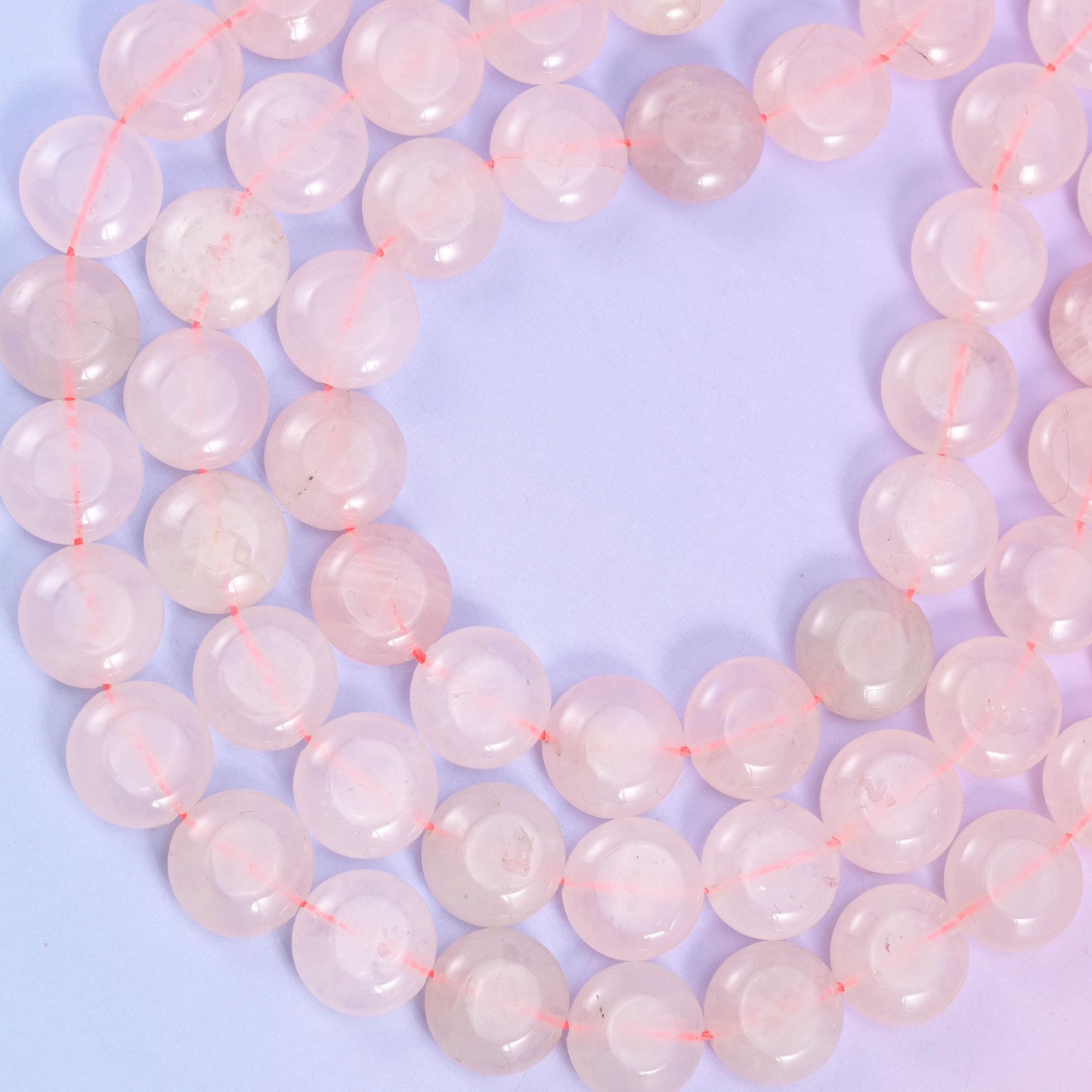 Rose Quartz coin beads, approximately 26 beads per strand