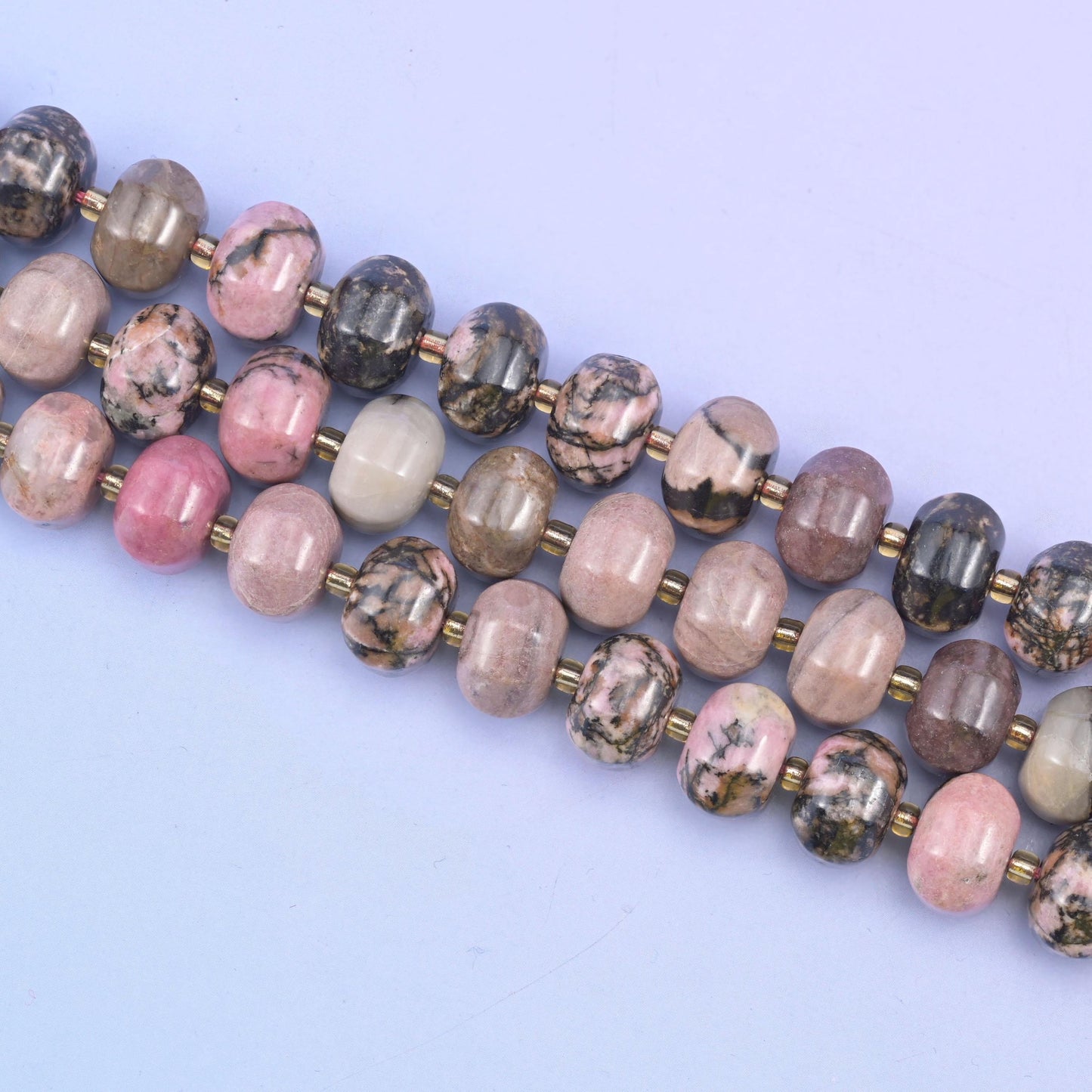 Rhodonite beads in soft pink with striking black matrix veining