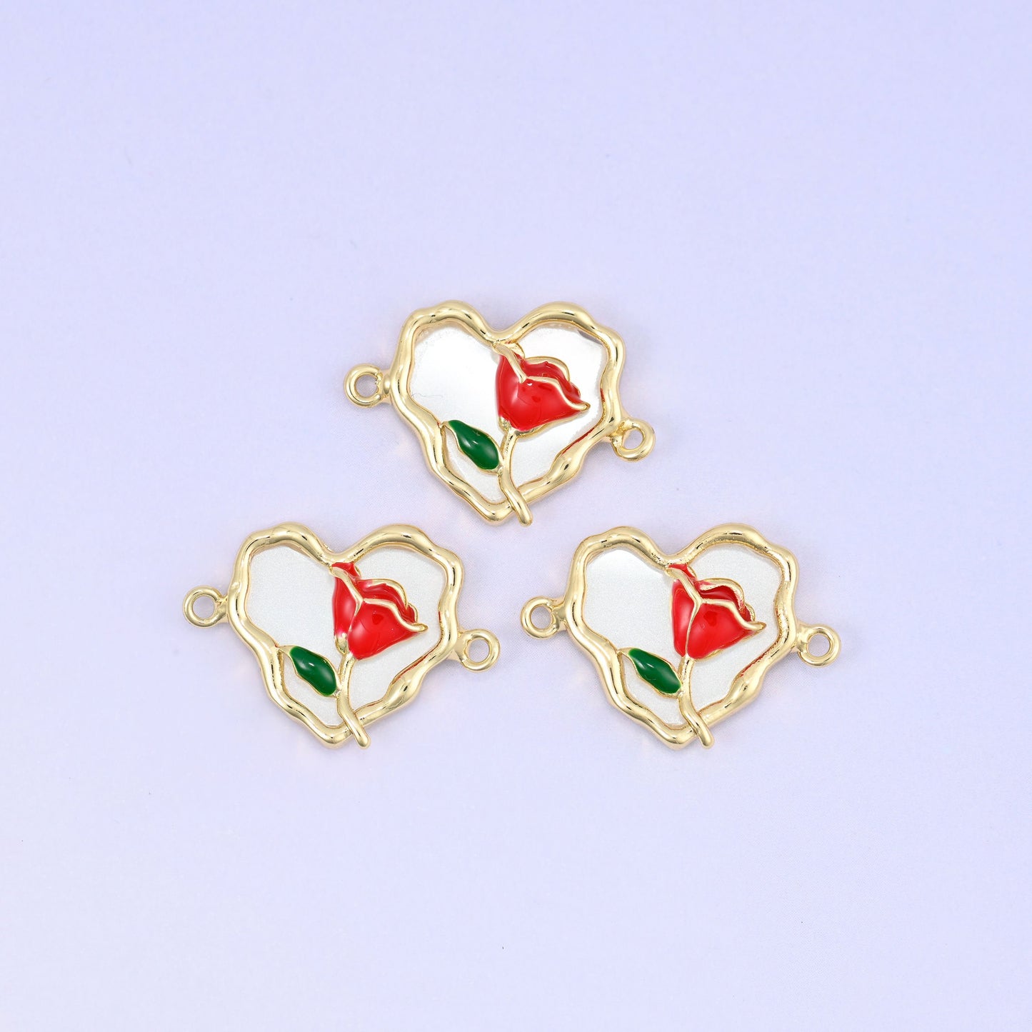 Scalloped heart pendant with red enamel rose, green leaf and white enamel back
