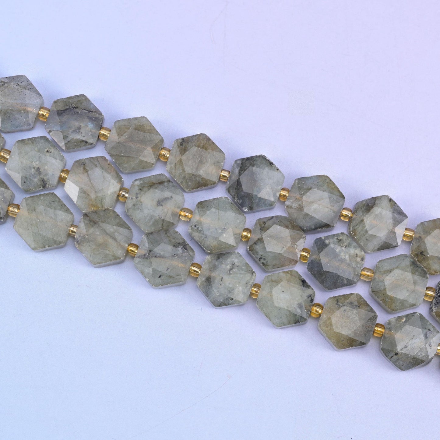 Gray labradorite beads in smoky grey-green with dark mineral speckling