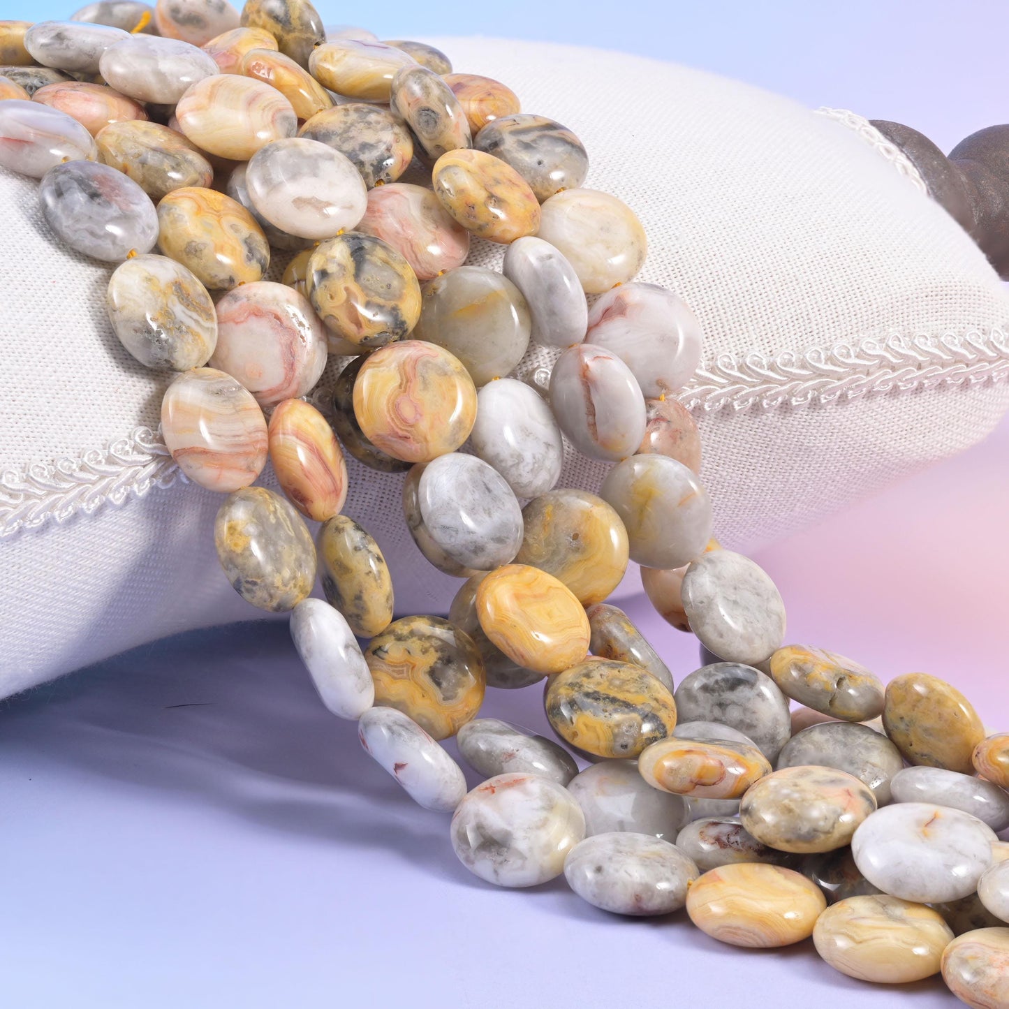 Natural Crazy Agate smooth coin beads in cream and soft grey with ribbons of warm ochre and dusty pink
