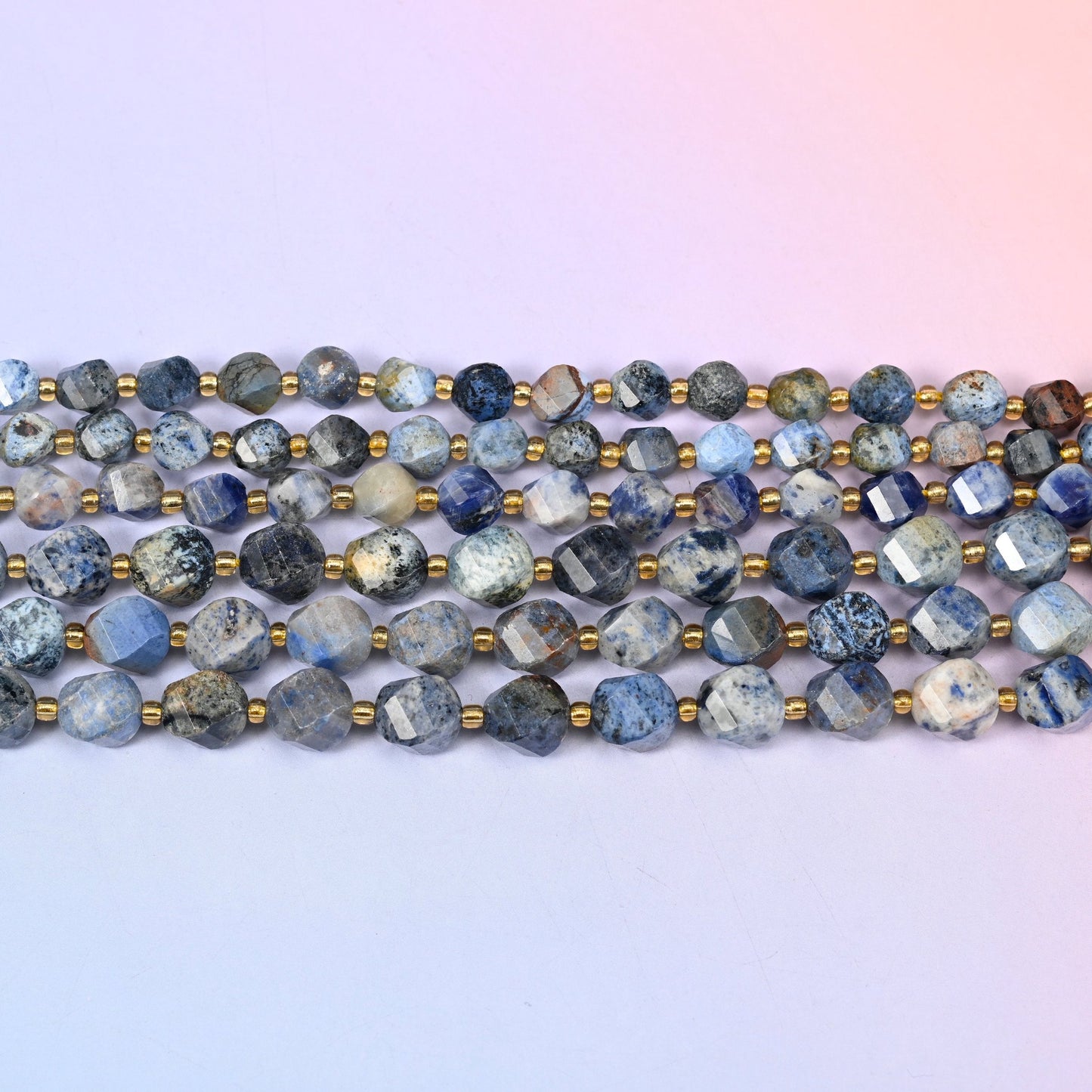 Sunset Dumortierite beads in dusty denim blue and pale grey with rust-brown patches
