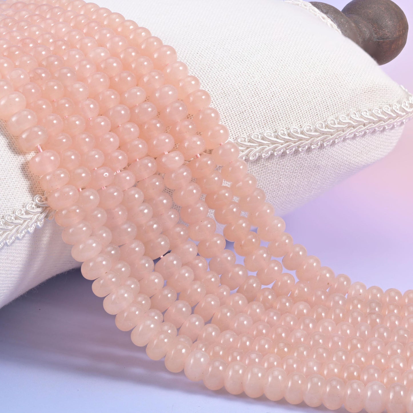 Soft Pink Dyed Jade smooth rondelle beads in an even blush pink with a faint warm peach cast