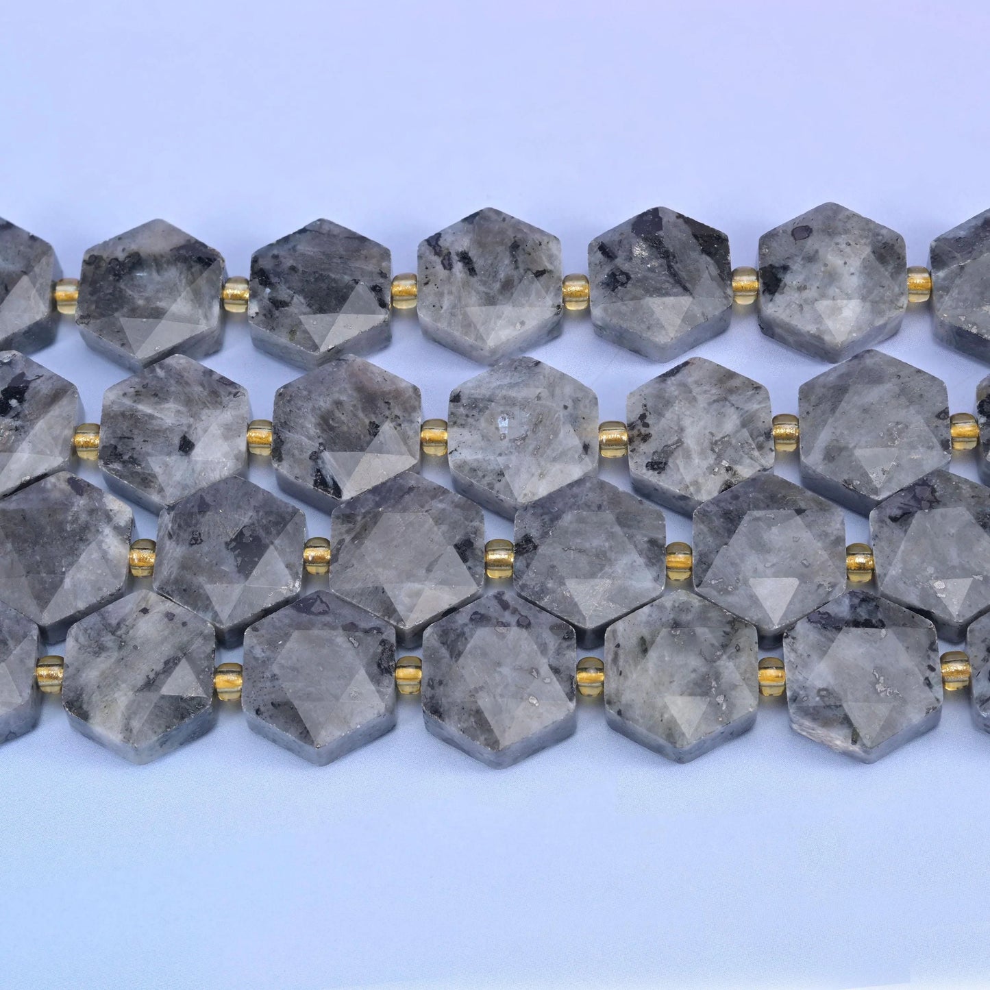 Rows of 12mm Labradorite hexagons separated by small gold-tone spacer beads