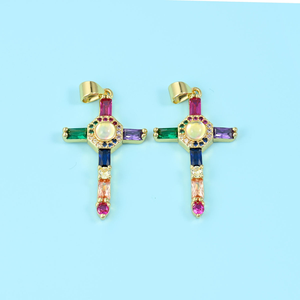 18K gold plated cross zirconia pendant in a mixed colourway, green, violet, blue, peach and pink baguette stones on two crosses.