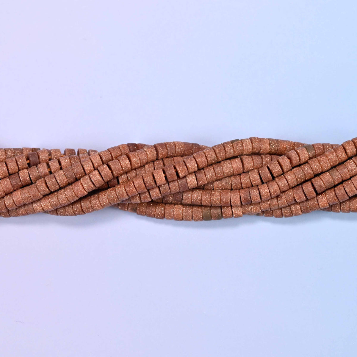 Gold sandstone (man-made glass) matte heishi disc beads in warm brown with shimmering copper flecks.
