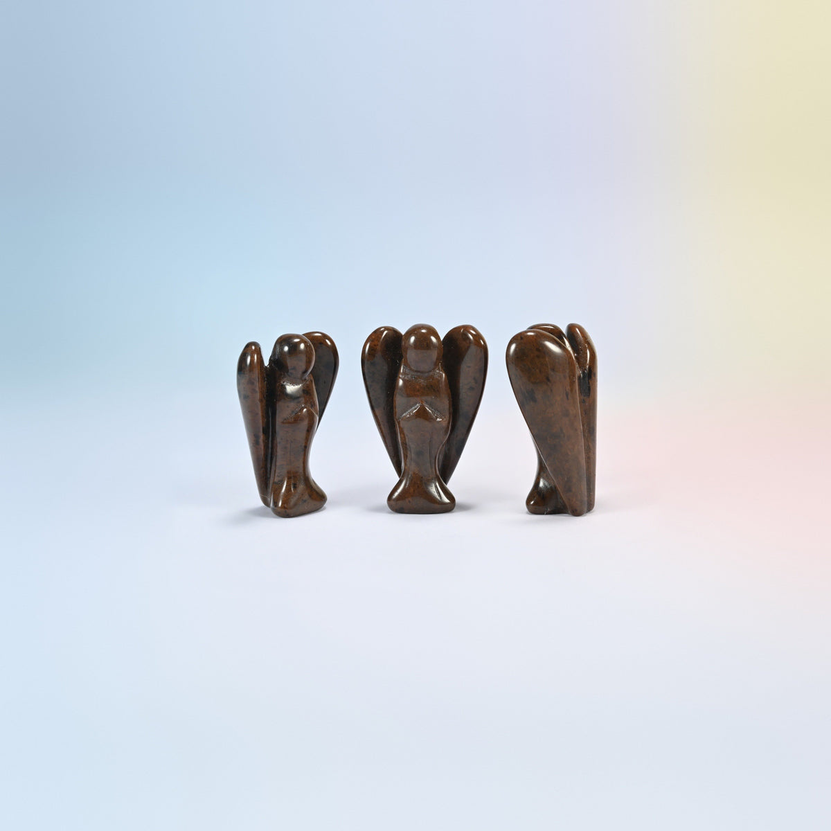 Three natural golden swan guardian angel carvings, dark brown with black patches, 2 inch