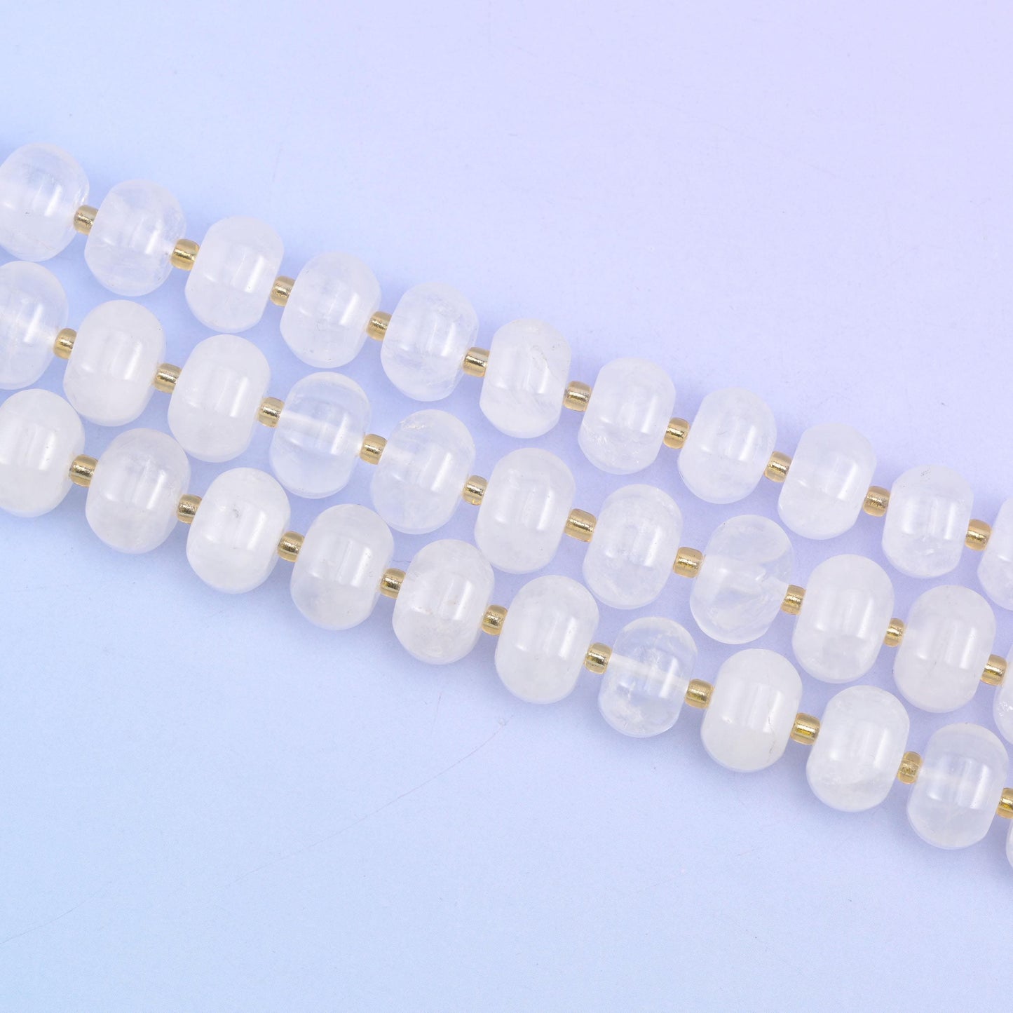 Two strands laid straight, each 12x8mm rondelle separated by a small gold spacer