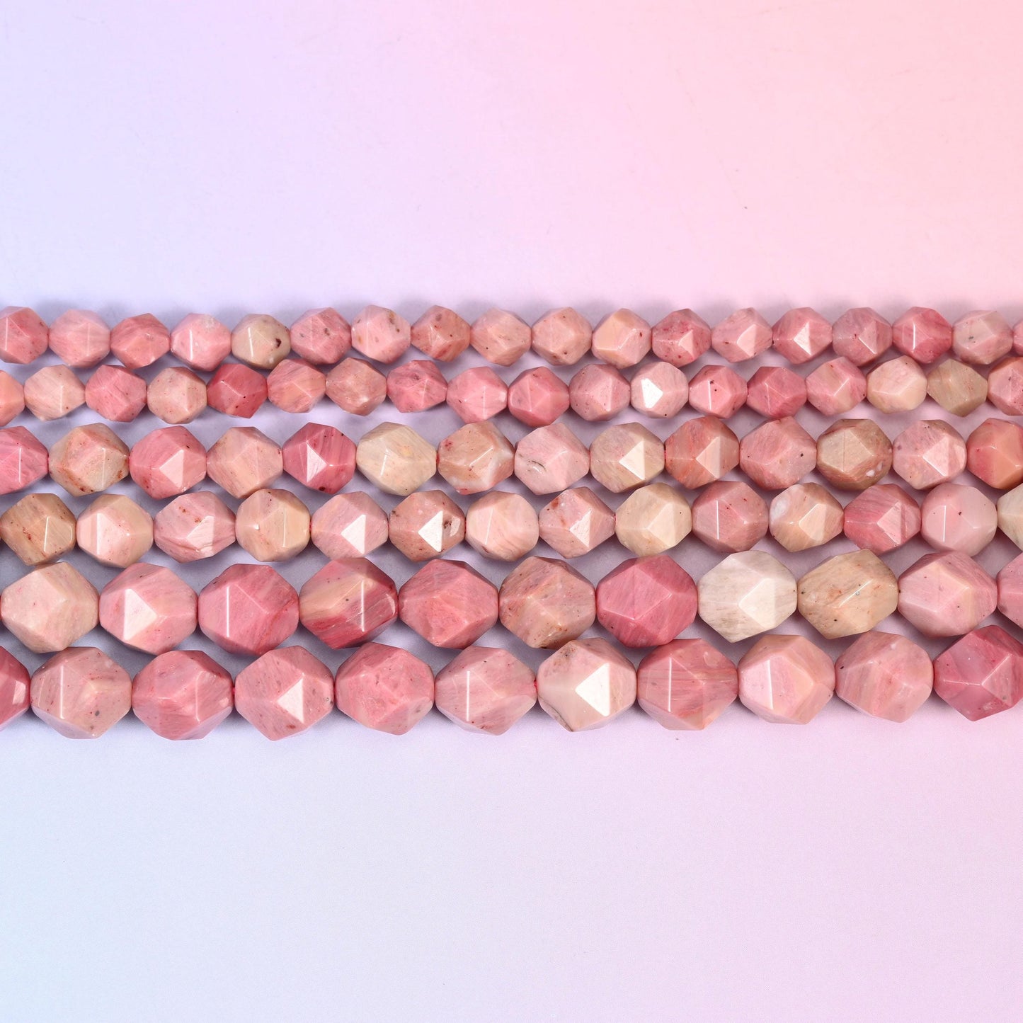 Pink Rhodonite in dusty rose stone mottled with oatmeal cream