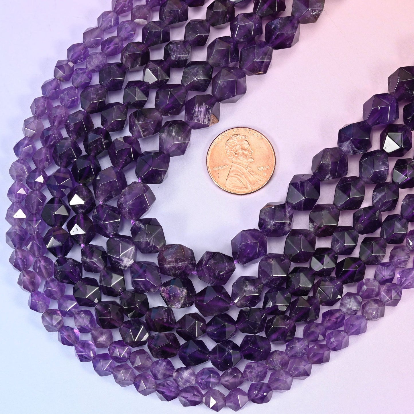Faceted diamond star cut Amethyst beads.