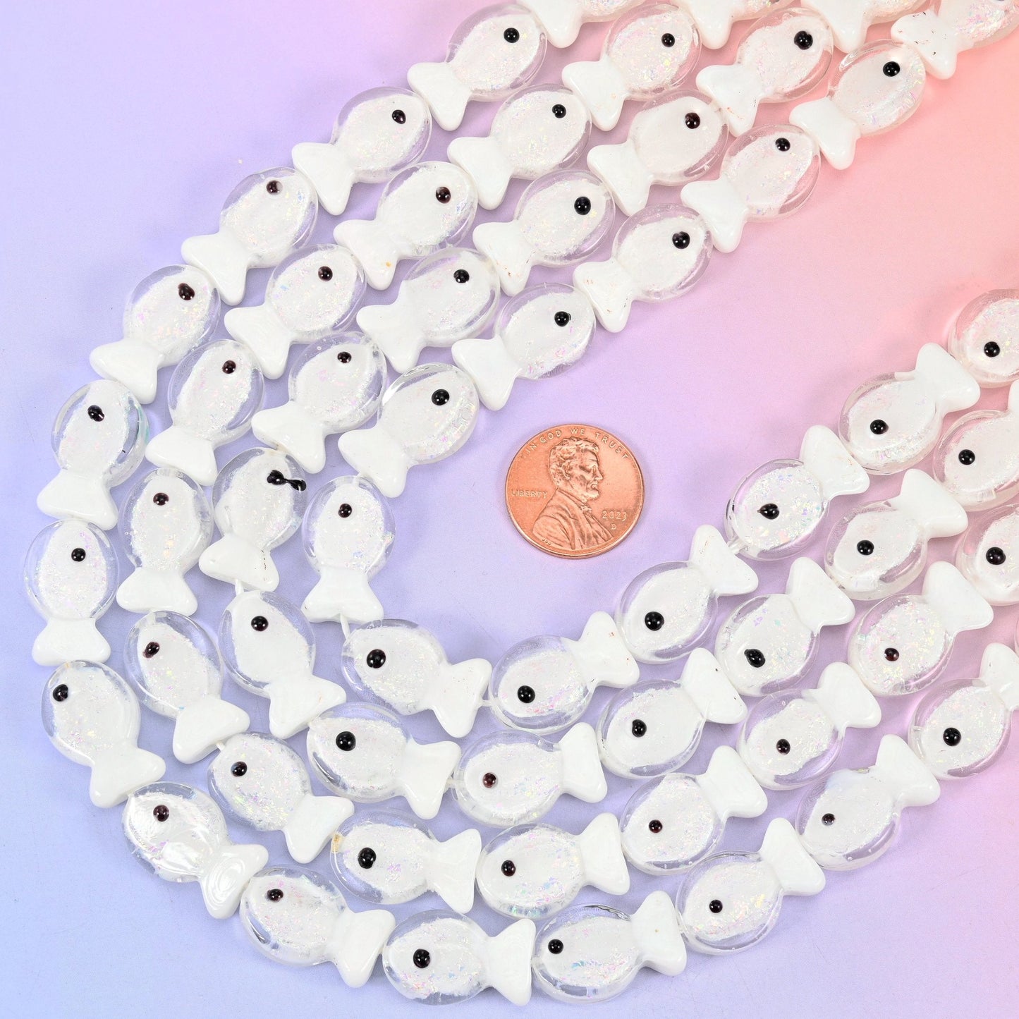 Fish shaped iridescent white glass beads