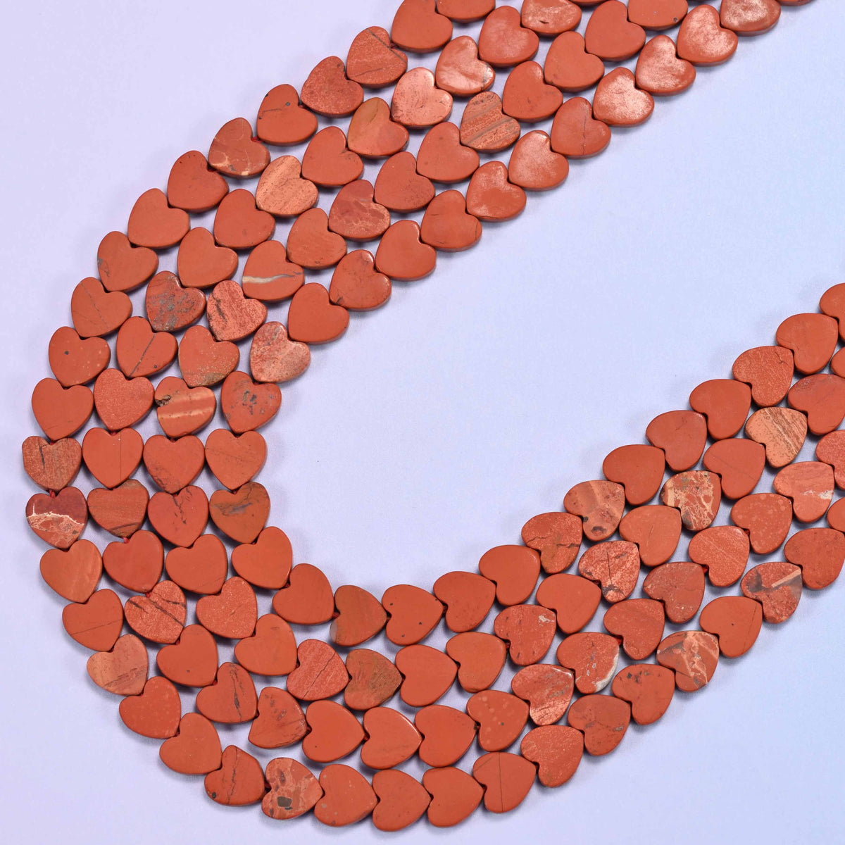 Matte red jasper flat heart beads, 15 inch strand