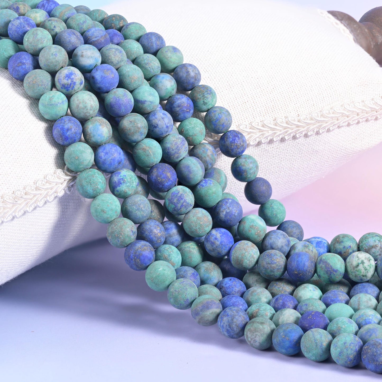 Phoenix Lapis Matte Round Beads, sea green and turquoise blotched with deep royal blue and rust-brown