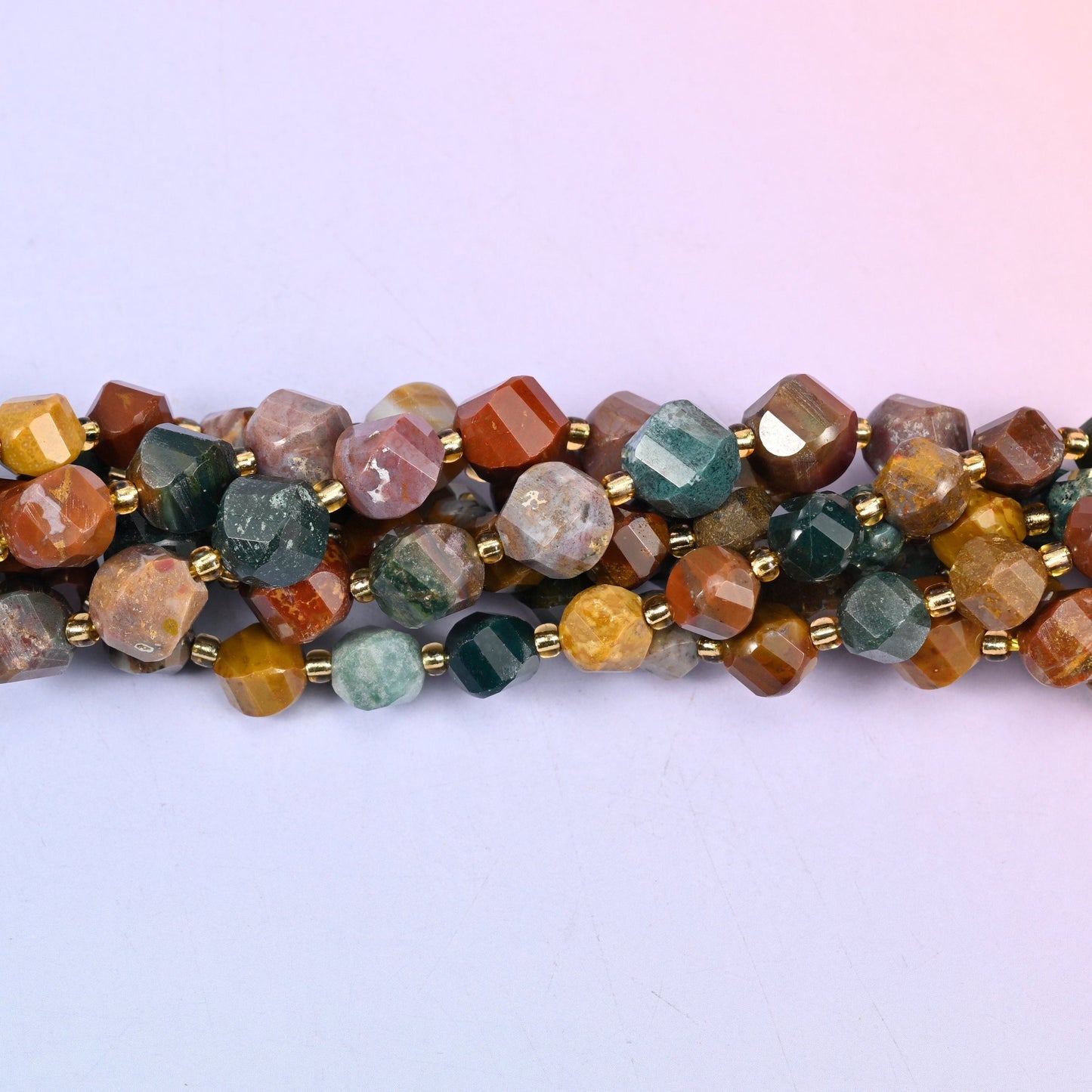 Ocean Agate Faceted Spiral Twist Beads, mustard yellow, sea green, rust red, cream and smoky grey running together