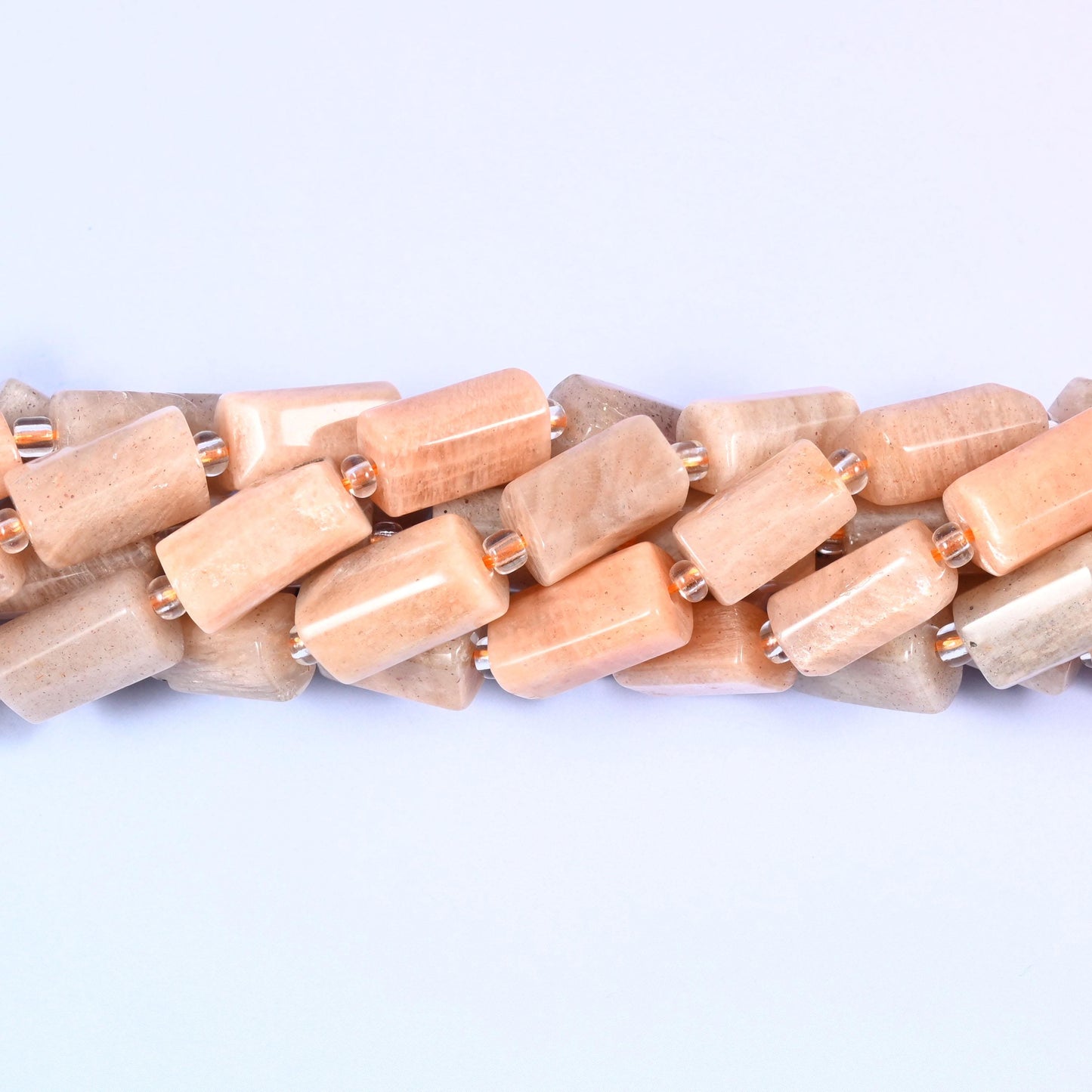 Natural Peach Moonstone faceted tube cylinder beads with a soft peach color and a sleek, modern shape