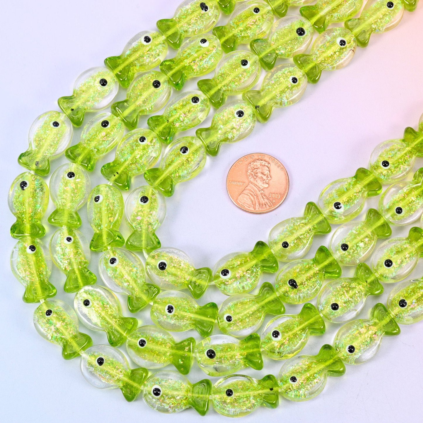 Fish shaped iridescent lime green glass beads