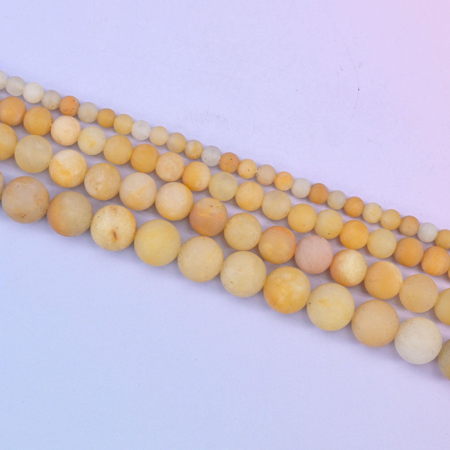 Yellow Jade Matte Round Beads in soft butter and honey yellow with cream and pale apricot