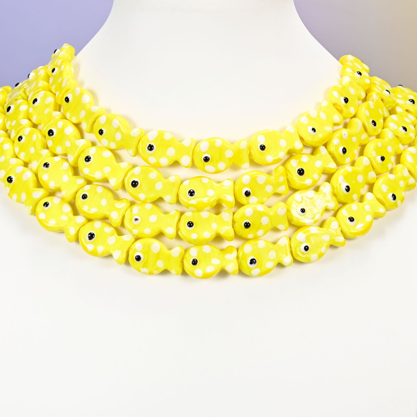 Fish glass beads, yellow with white dots, 19x12mm