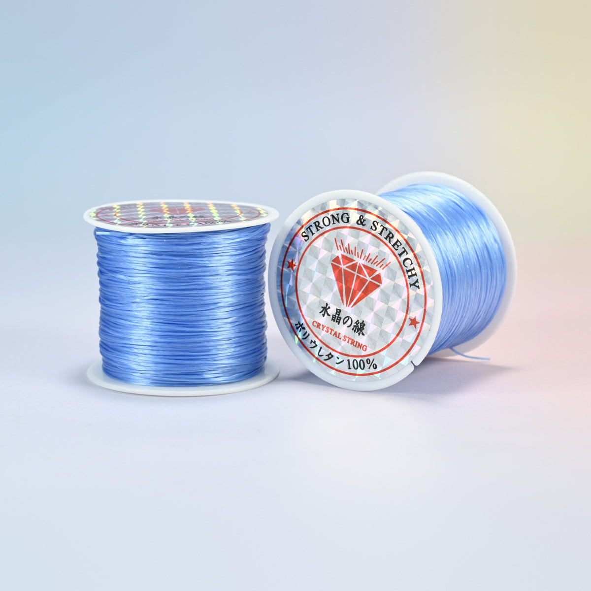Two rolls of medium blue 0.7-0.8mm elastic stretch string, glossy polyurethane bead cord with a holographic label