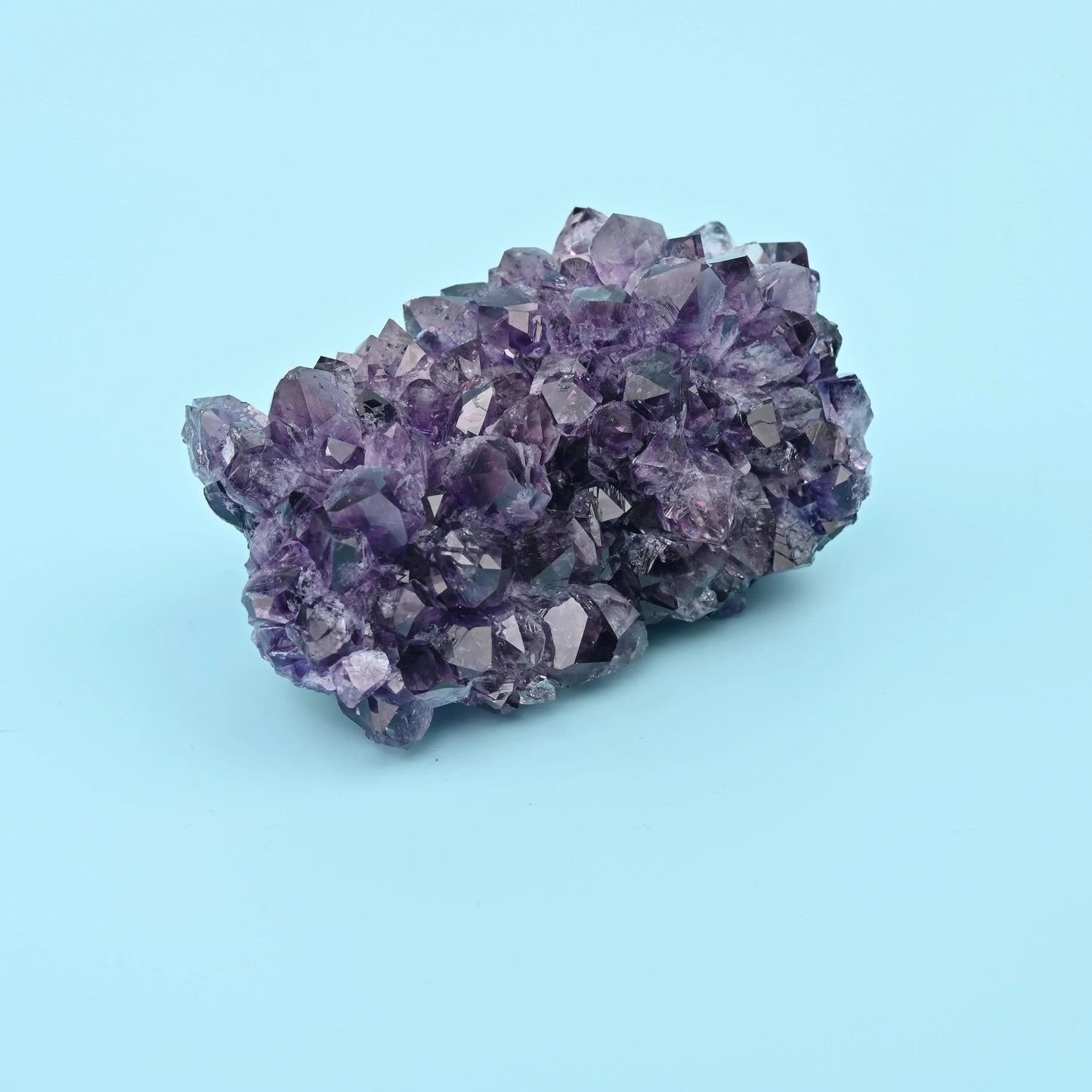 Amethyst quartz cluster, 2 inches tall, 4 inches wide.