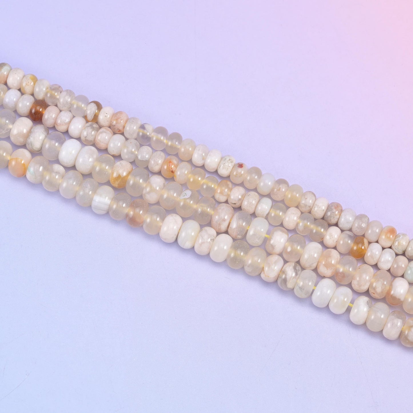 Sakura Agate rondelle beads in cream, translucent white, and golden-peach tones