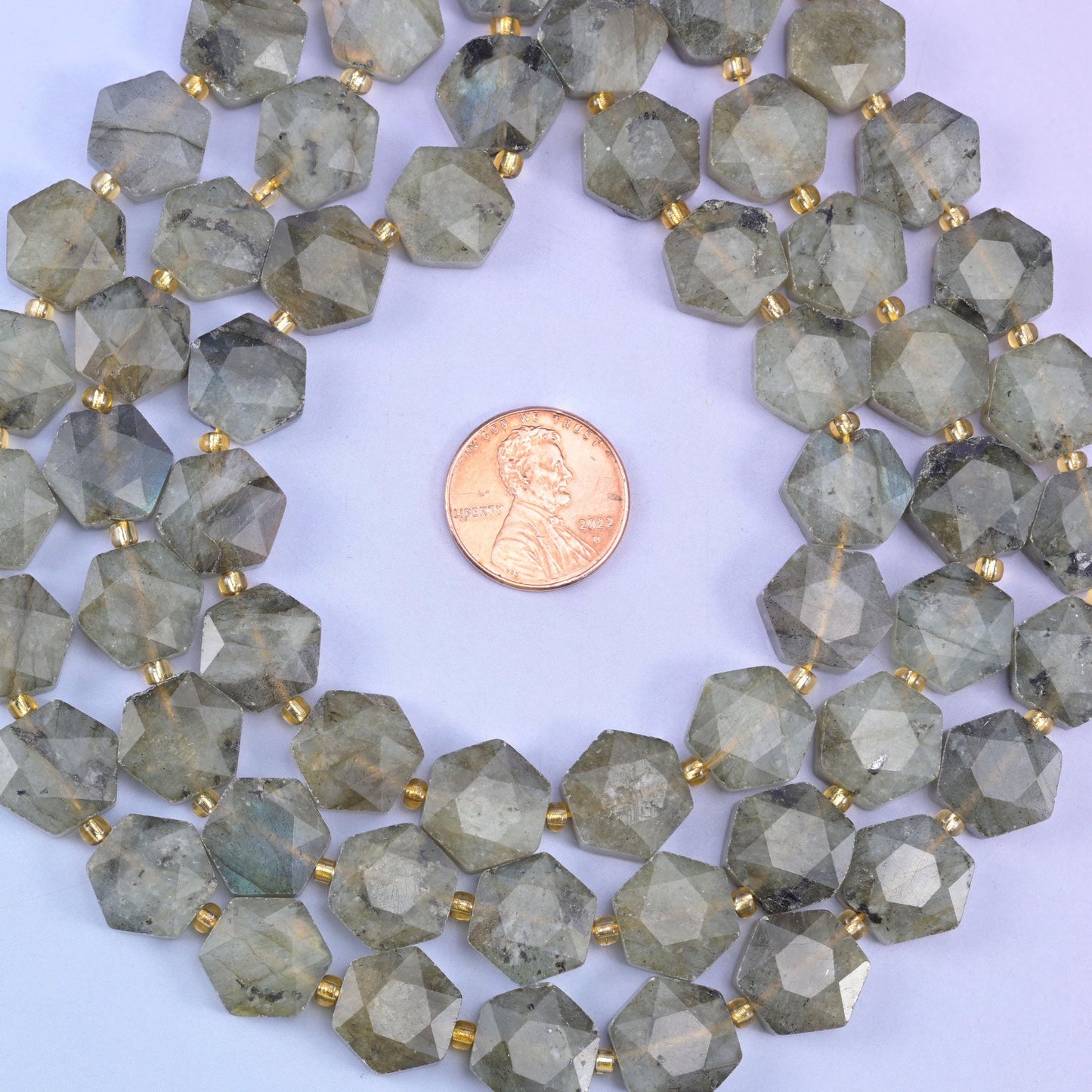 Gray labradorite hexagon beads, approximately 27 beads per strand