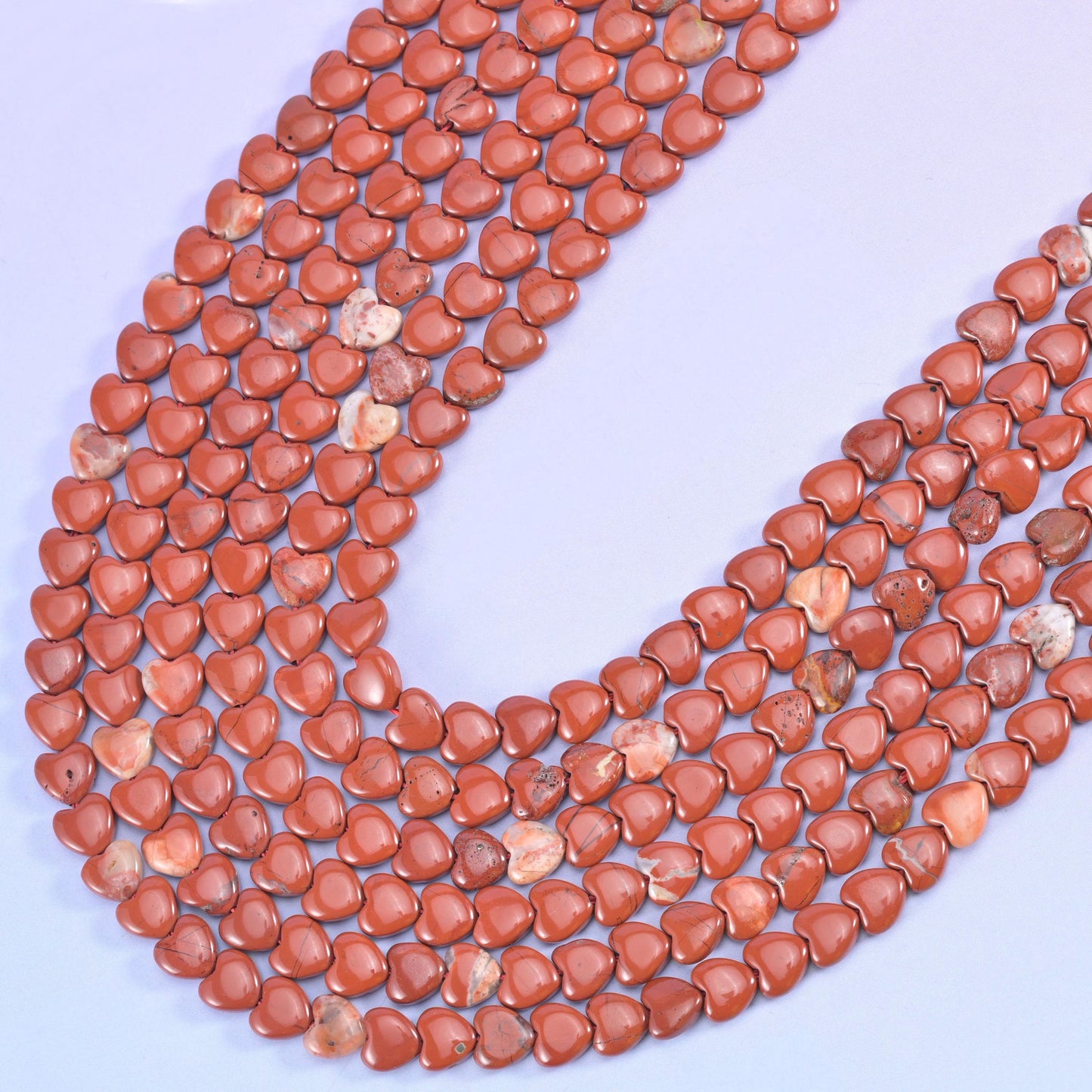 Red jasper heart beads, approximately 70 beads per strand