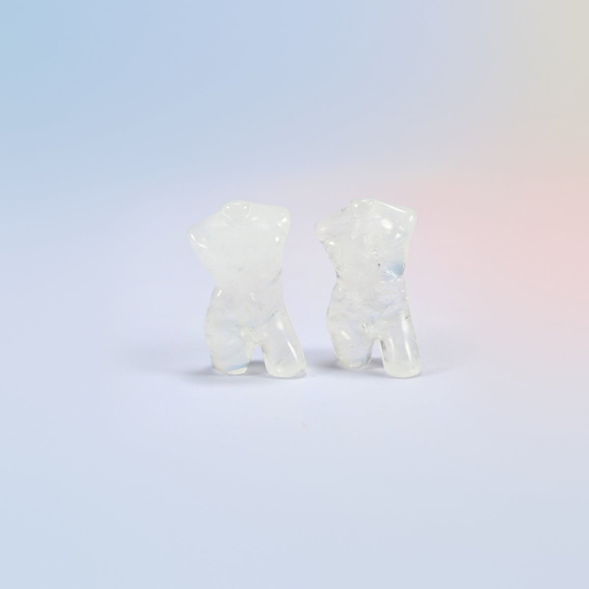 Two natural clear quartz male goddess torso carvings, 1.3 inch, icy clear