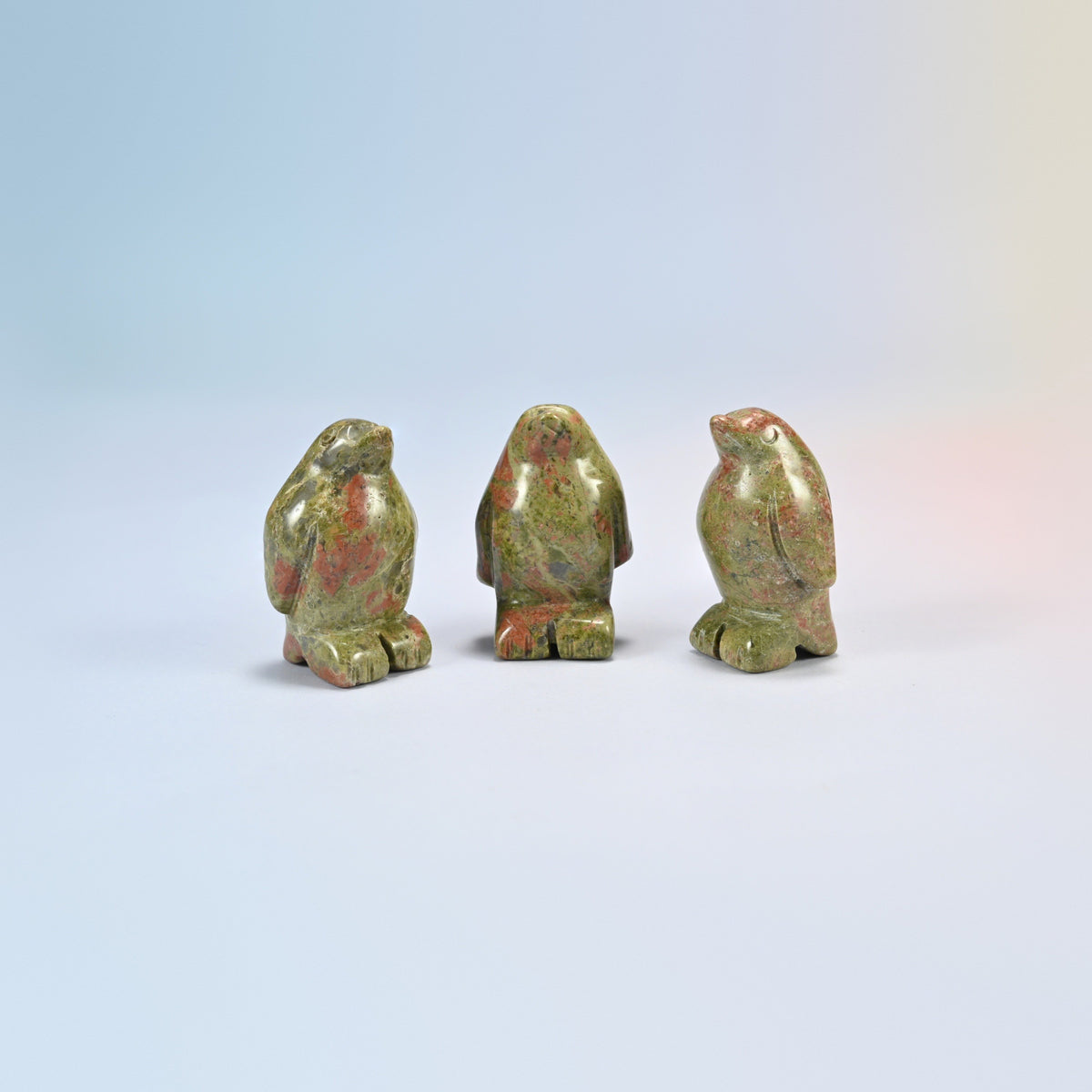 Three unakite penguin crystal carvings, 1.5 inch, green and pink natural stone
