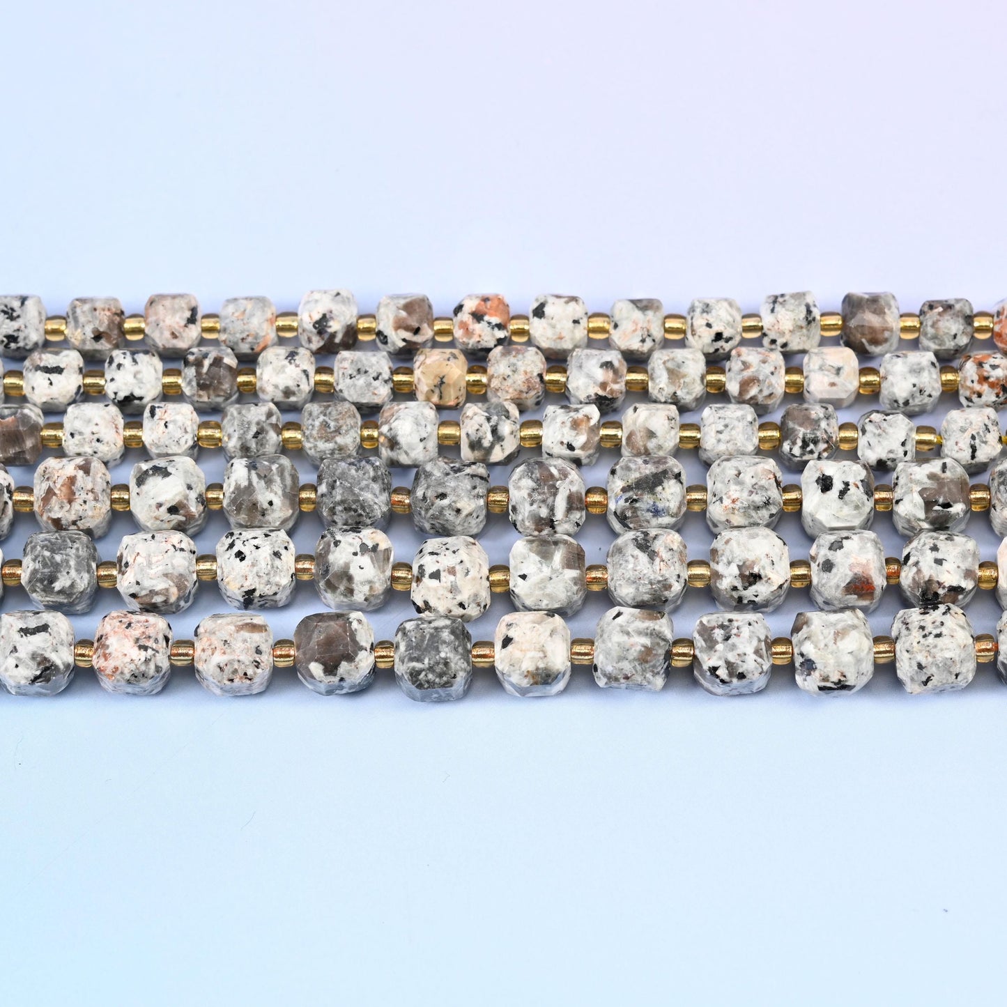 Yooperlite Faceted Cube Beads in pale grey and off-white with dark speckling