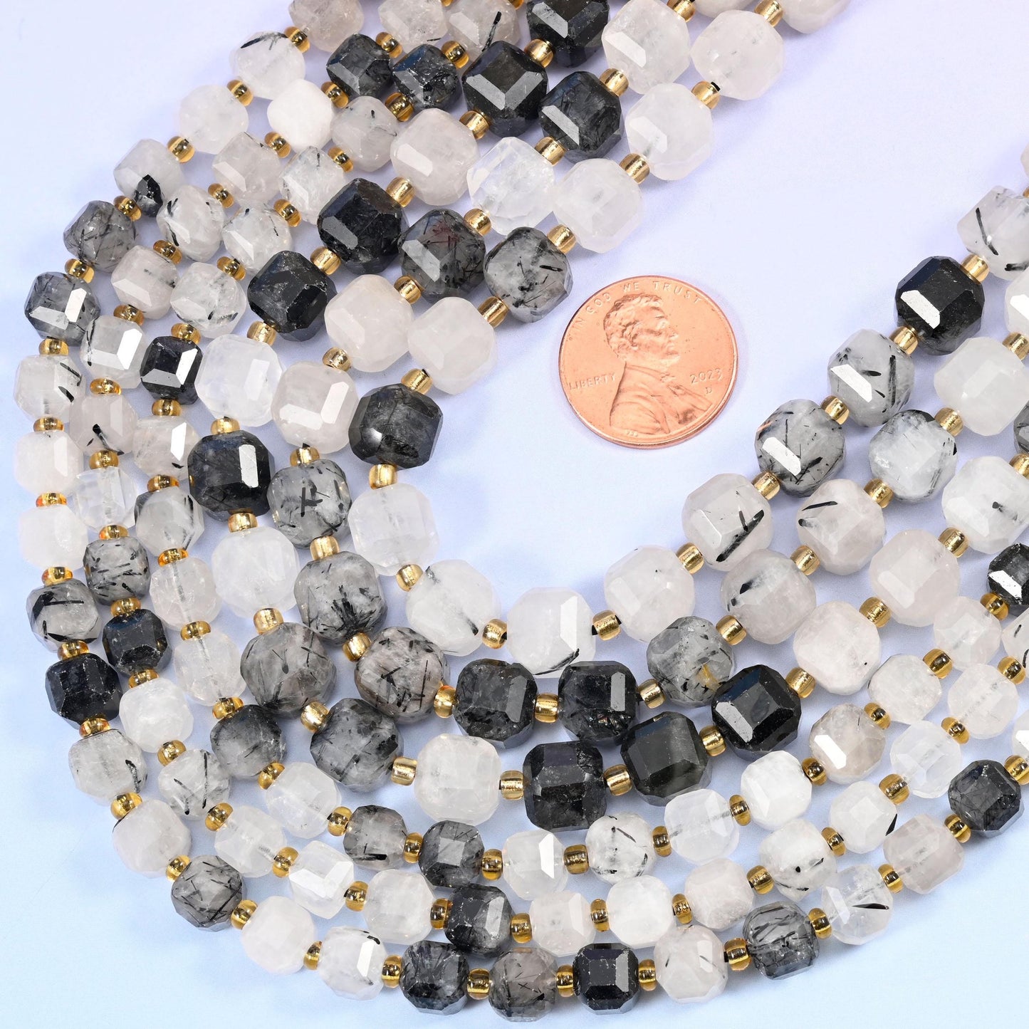 Faceted cube with cut corners cut black rutilated quartz beads