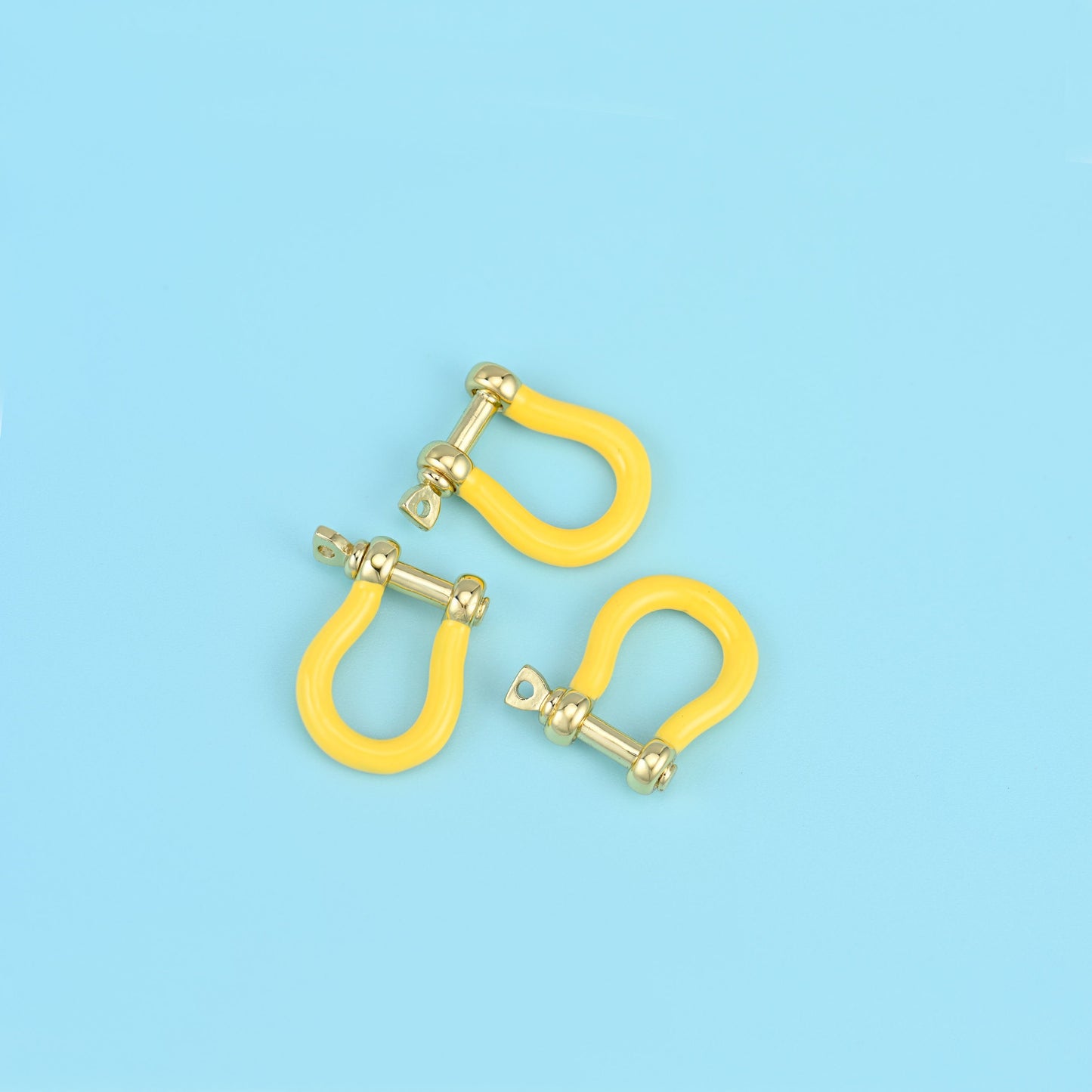 Brass and 18k gold filled horseshoe clasp with enamel detail