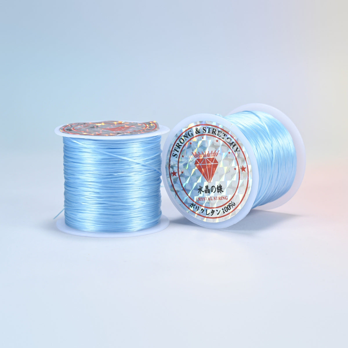 Two rolls of sky blue 0.7-0.8mm elastic stretch string, glossy polyurethane bead cord with a holographic label