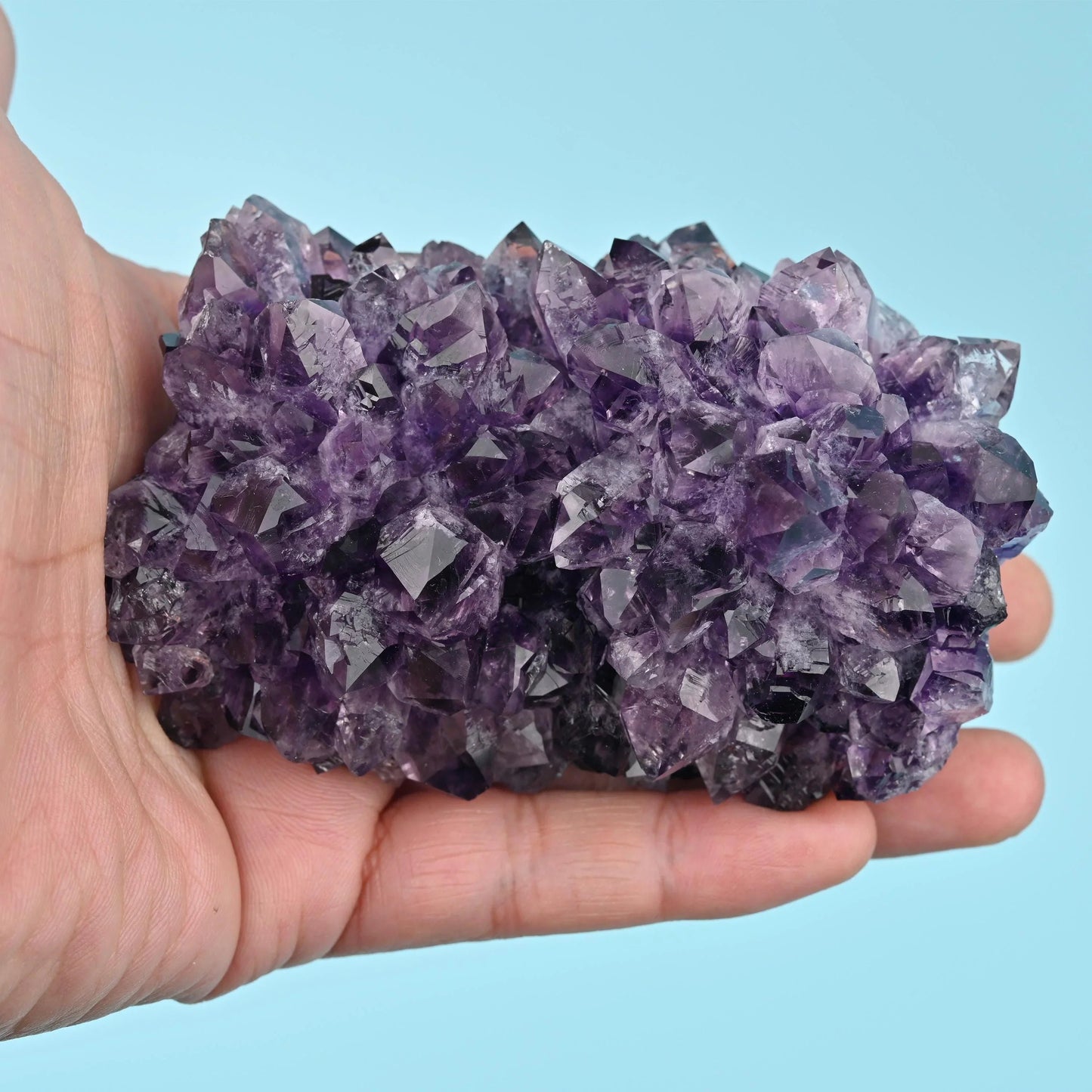 Unpolished raw amethyst crystal points in cluster form.