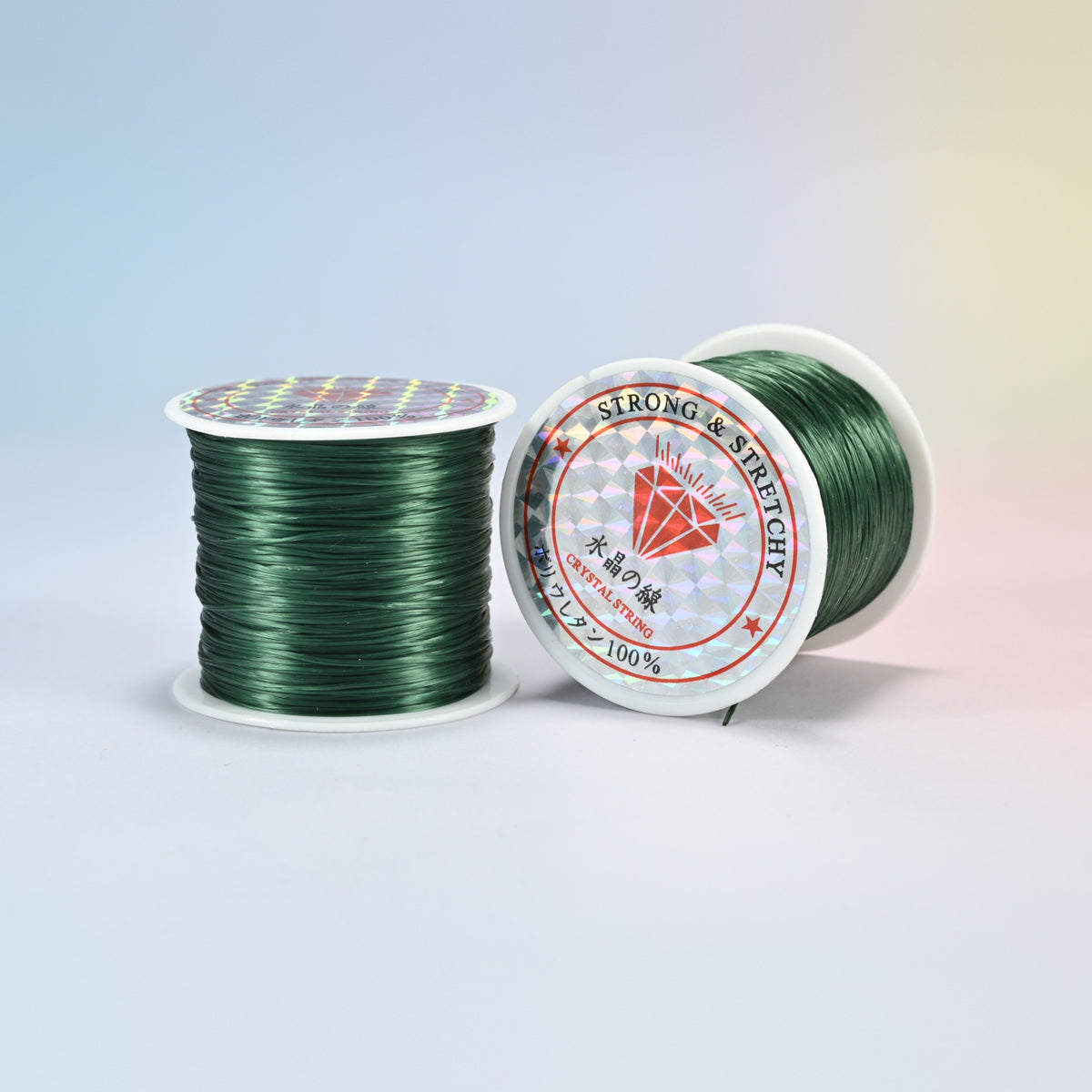 Two rolls of dark green 0.7-0.8mm elastic stretch string, glossy polyurethane bead cord with a holographic label