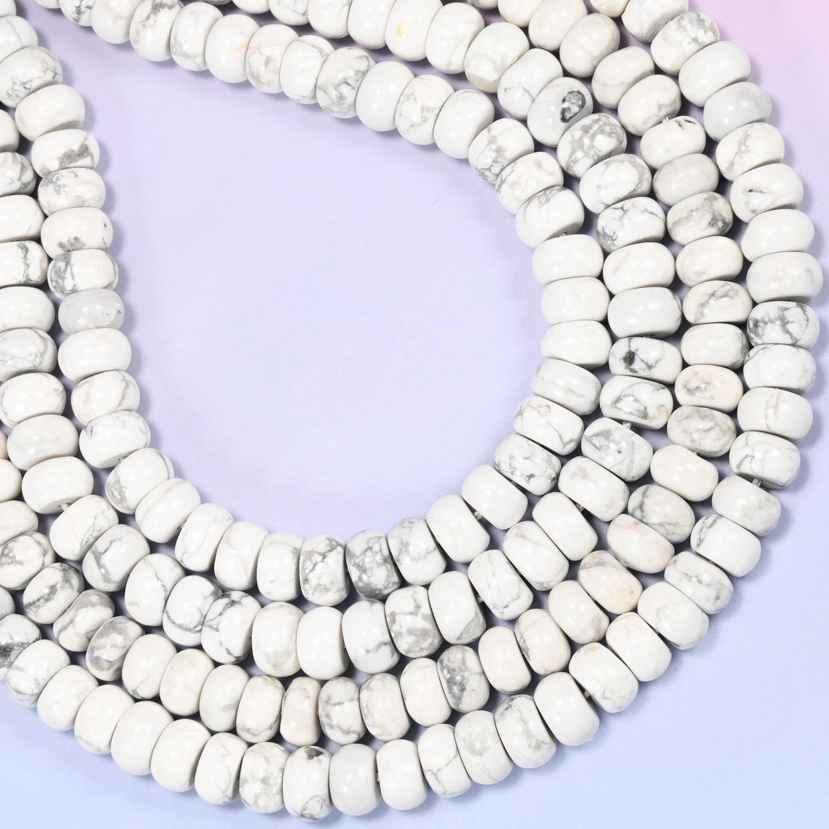Natural White Howlite Rondelle Beads with a large 2.5mm centrally drilled hole.