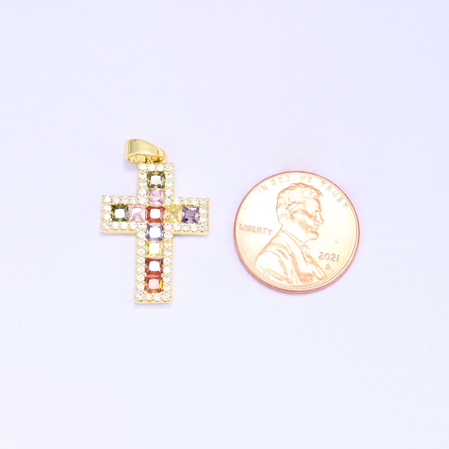Zirconia cross charm in gold plated brass, shown at 24.15 x 16.29mm including the ring