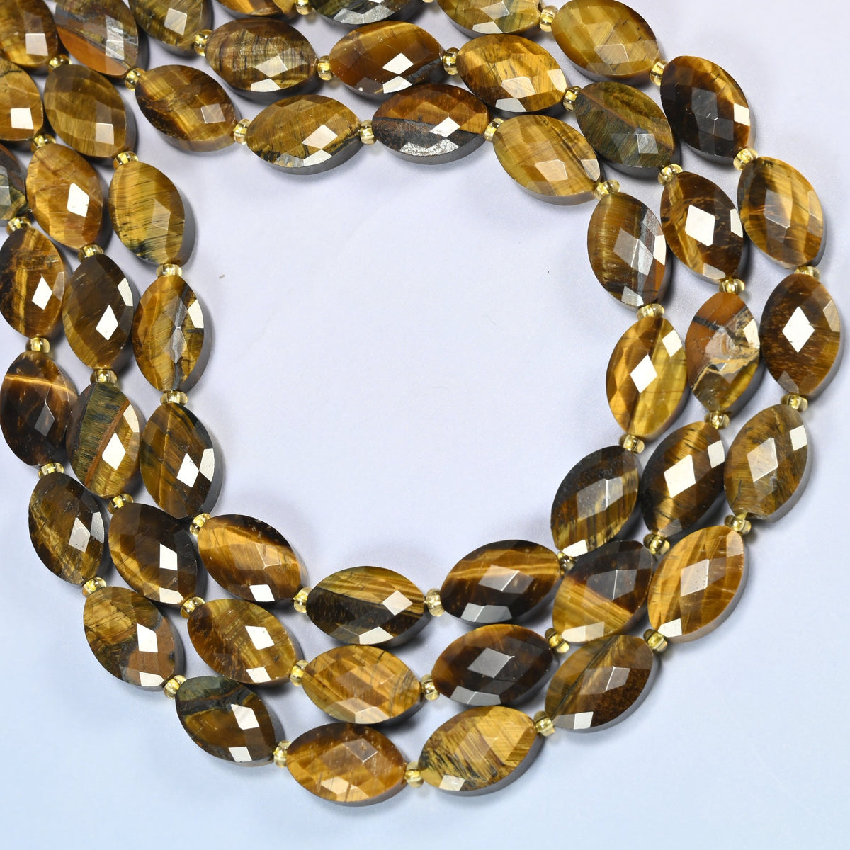 Tiger eye faceted flat oval beads curved into an open loop, golden brown beads with silky dark bands