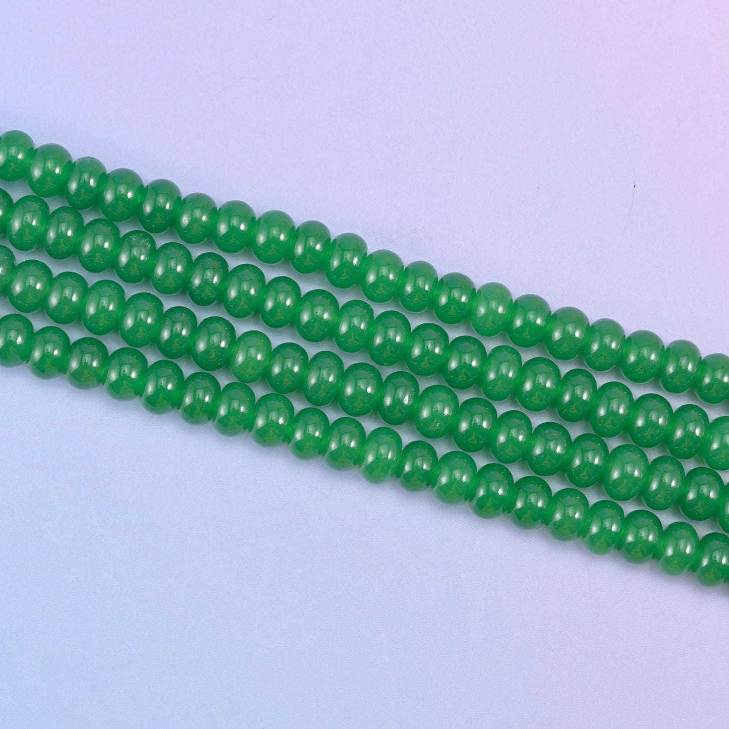 Green Dyed Jade beads in a vivid emerald green tone