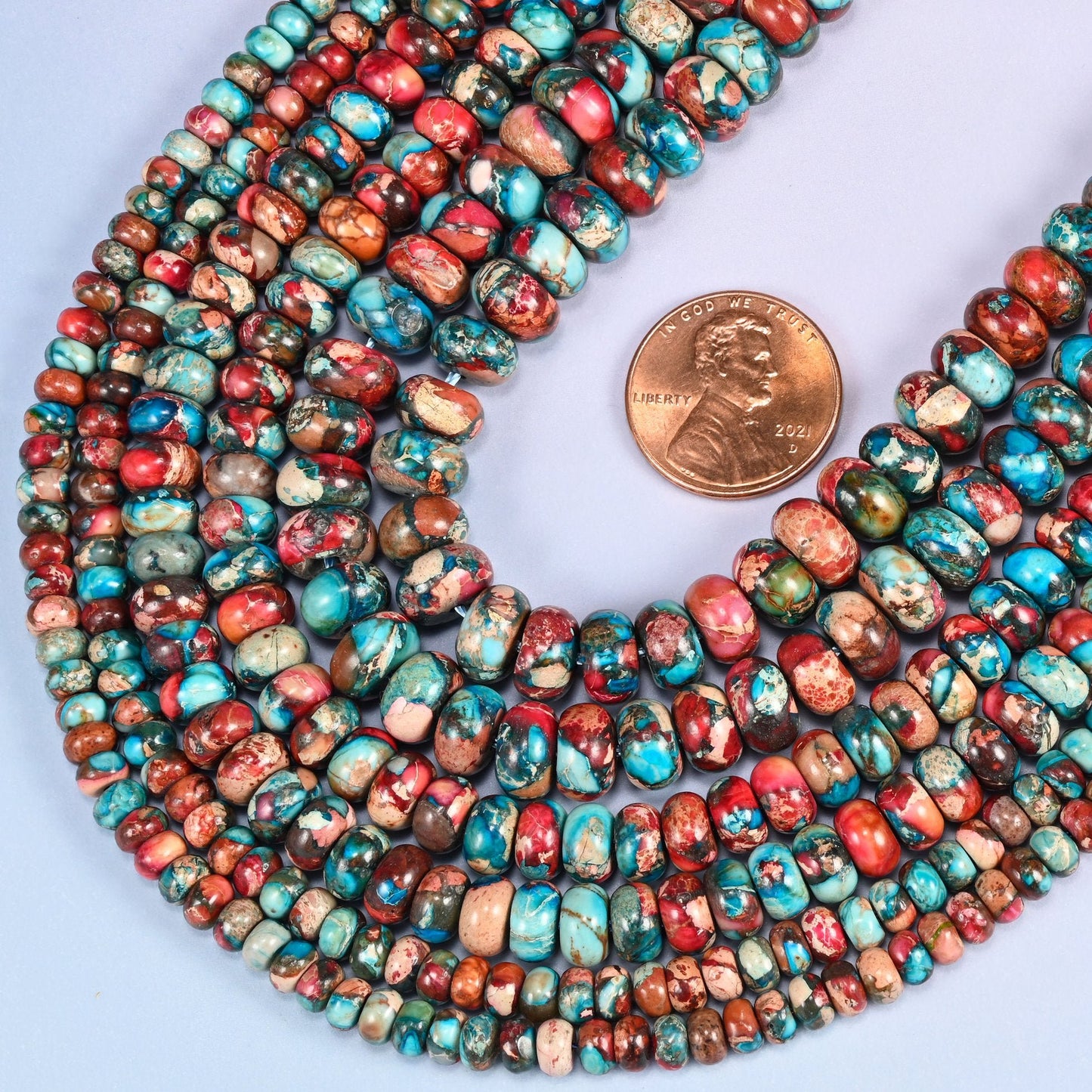 Rondelle cut Sea Sediment Jasper beads, dyed and colour-enhanced finish.