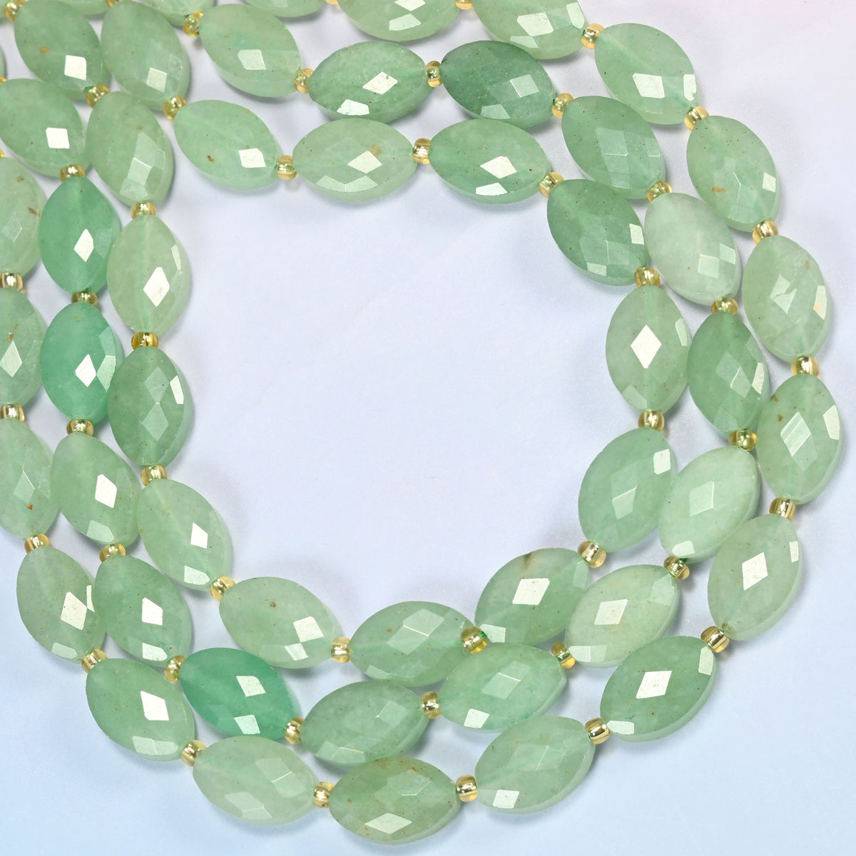 Green aventurine faceted flat oval beads curved into an open loop, mint and sage green beads